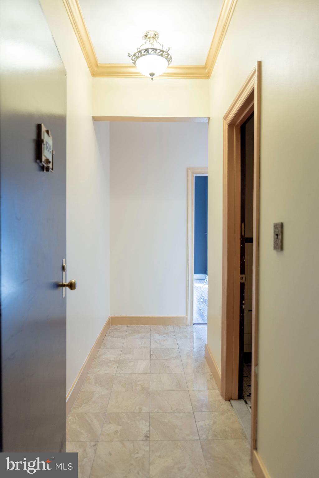 1 East Chase Street, Unit 804 Baltimore, MD 21202 - Photo 12 of 31 a view of a hallway to rooms