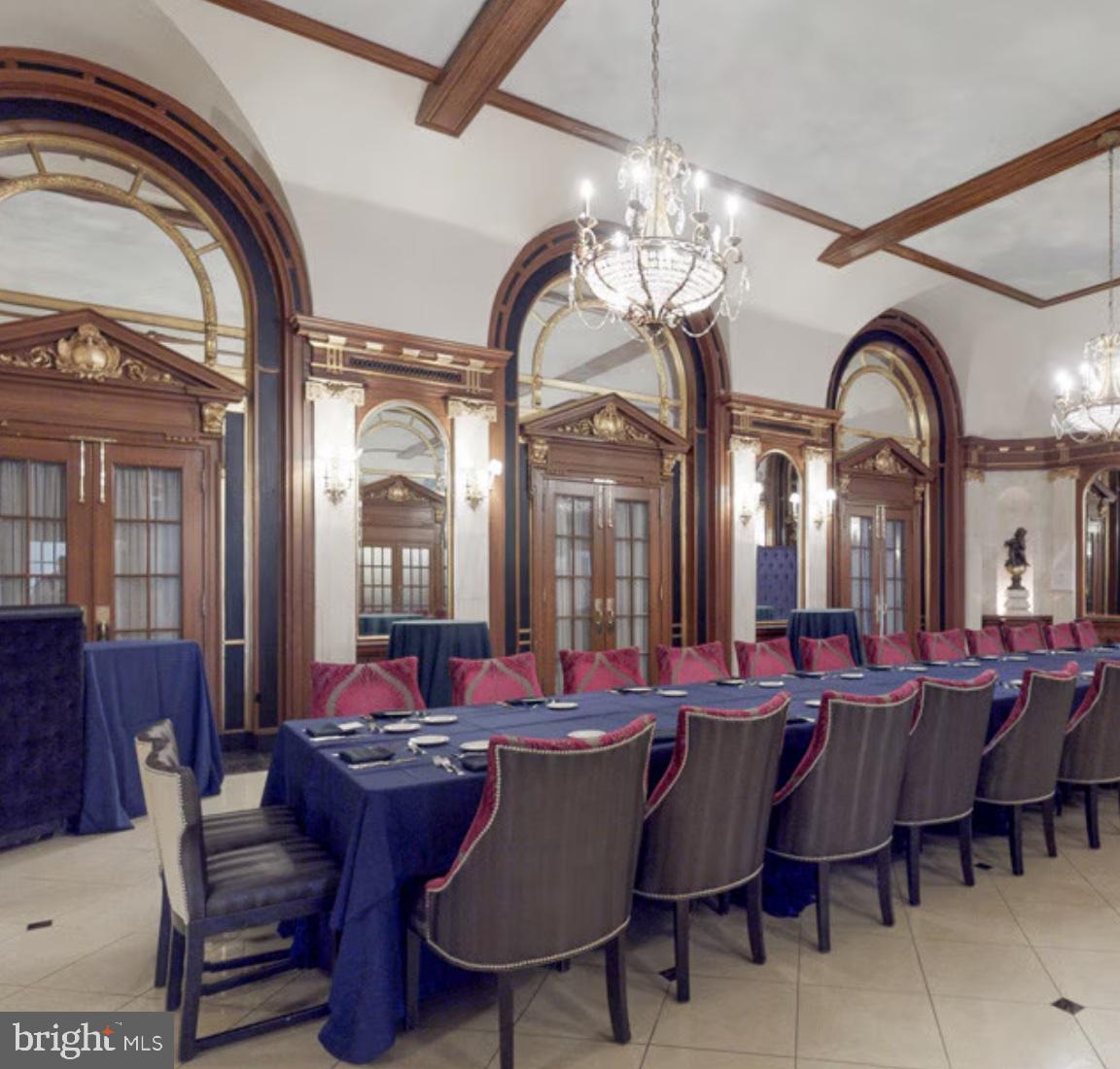 1 East Chase Street, Unit 804 Baltimore, MD 21202 - Photo 19 of 31 a view of a dining room with furniture and chandelier