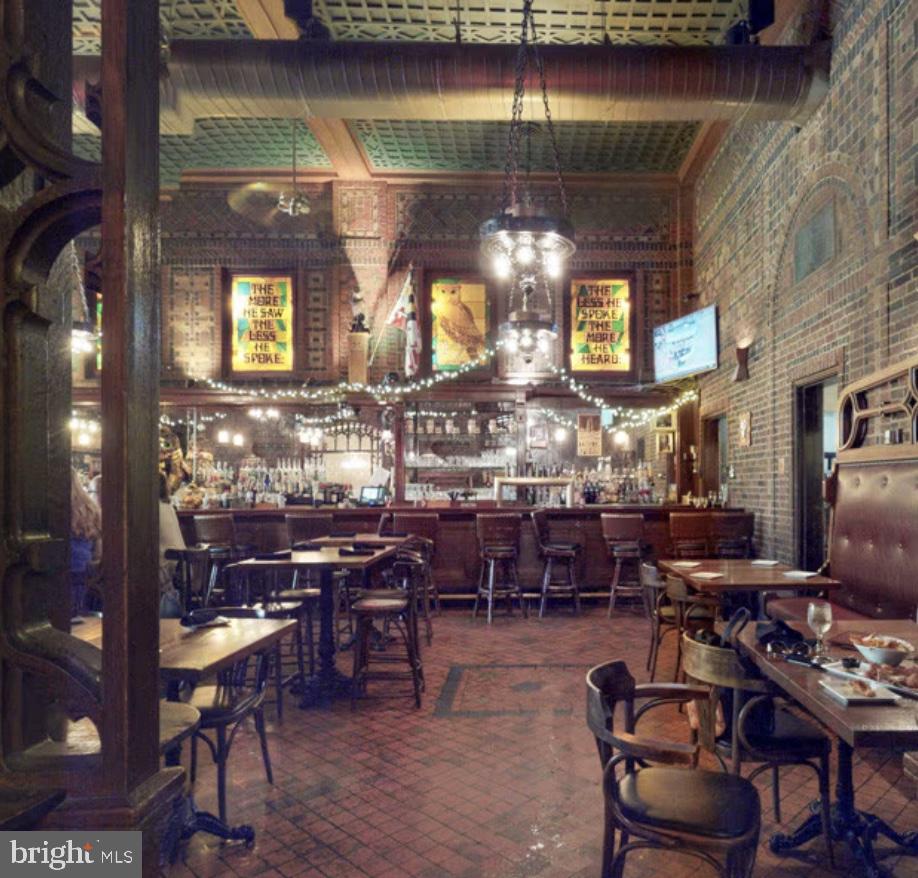 1 East Chase Street, Unit 804 Baltimore, MD 21202 - Photo 22 of 31 a room with lots of wooden furniture