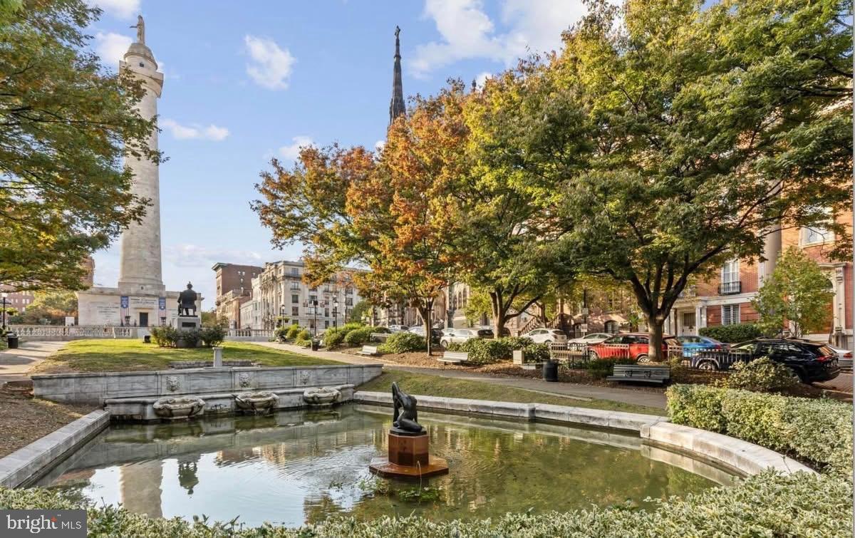 1 East Chase Street, Unit 804 Baltimore, MD 21202 - Photo 24 of 31 a view of swimming pool with outdoor seating and trees in the background