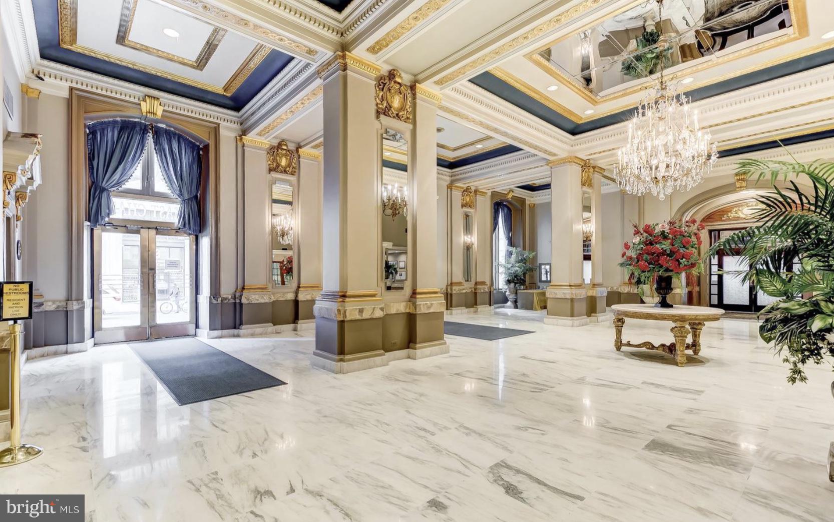 1 East Chase Street, Unit 804 Baltimore, MD 21202 - Photo 8 of 31 a lobby with furniture and large windows
