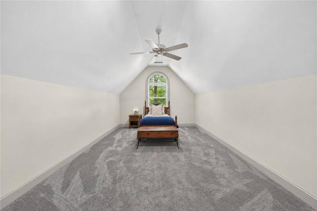 632 Geiger Road Jefferson, GA 30549 - Photo 36 of 55 an empty room with windows and ceiling fan