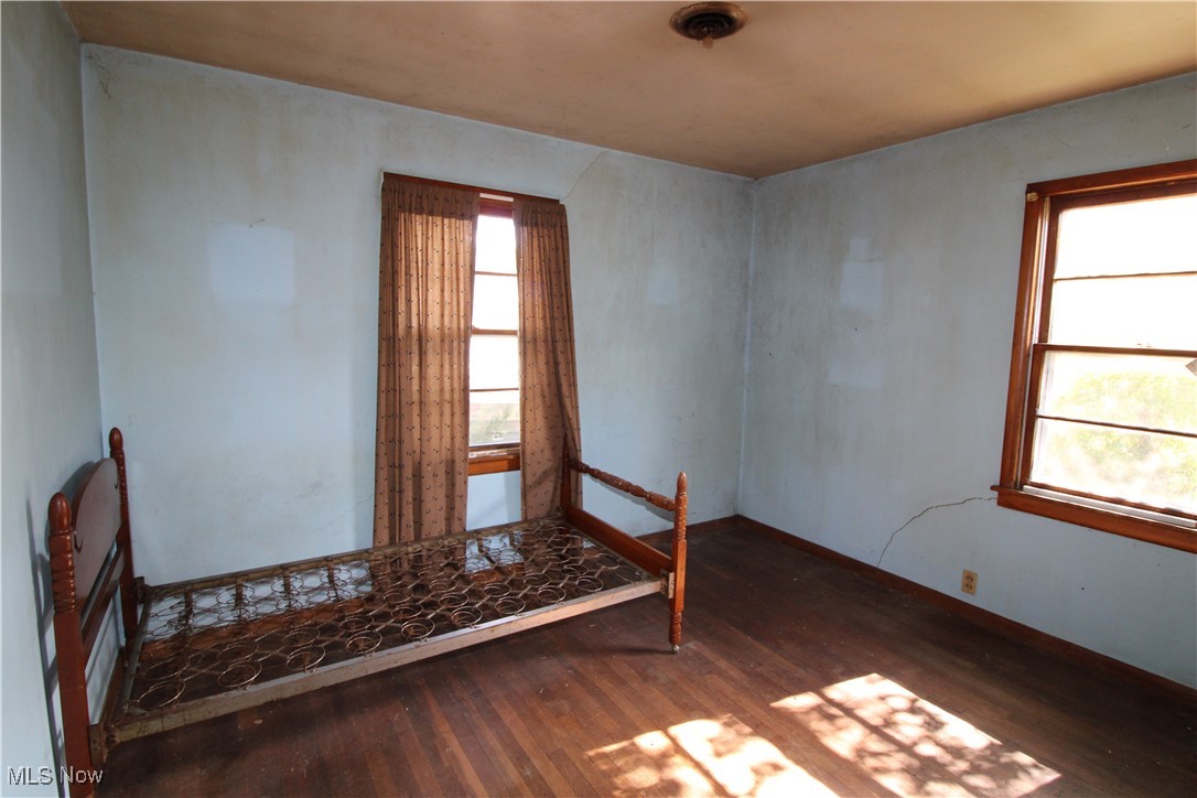 5084 West Fremont Road Port Clinton, OH 43452 - Photo 18 of 19 Spare room with dark wood-type flooring and baseboards