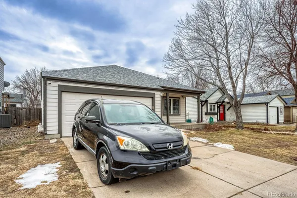a car parked in front of a house