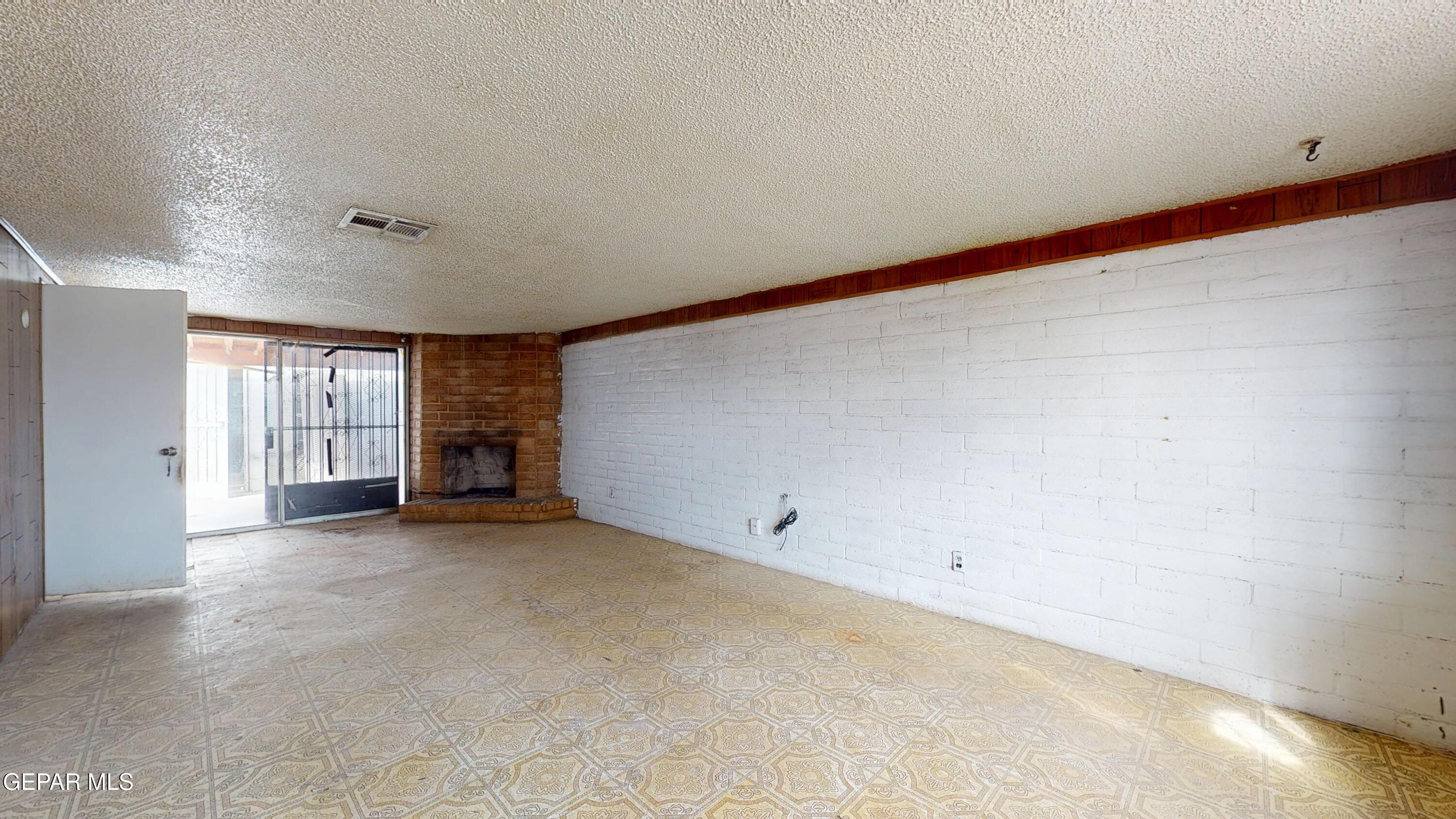 135 Baywood Road El Paso, TX 79915 - Photo 11 of 43 an empty room with windows