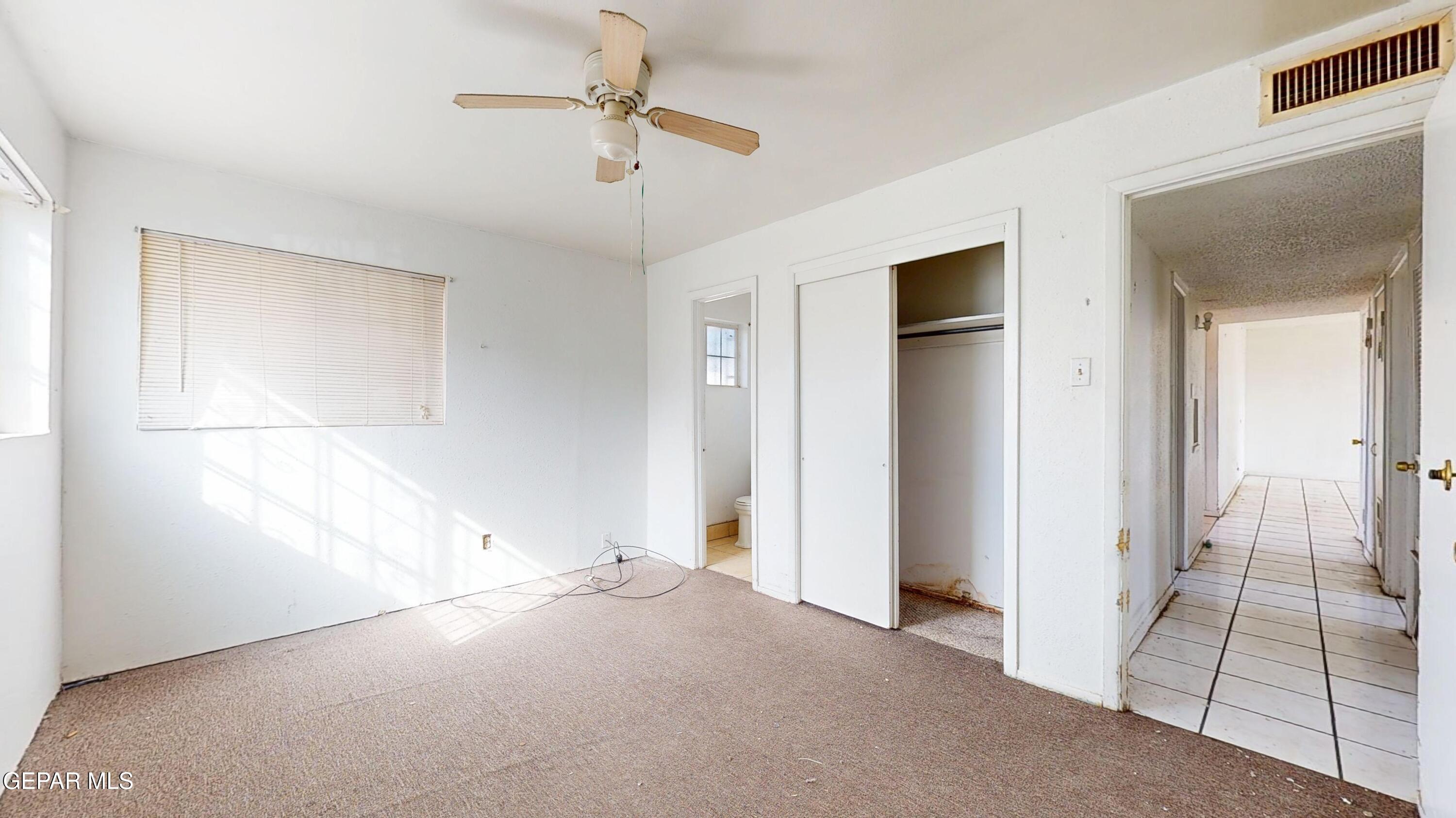 135 Baywood Road El Paso, TX 79915 - Photo 19 of 43 a view of empty room with wooden floor