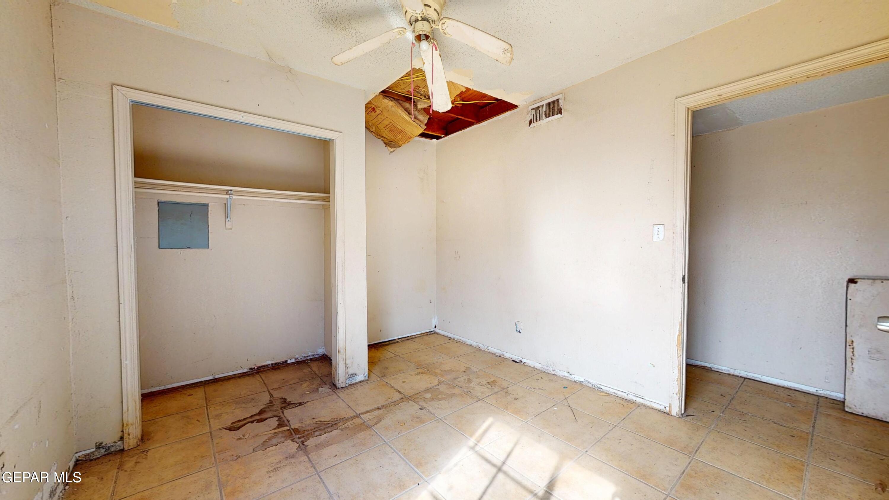 135 Baywood Road El Paso, TX 79915 - Photo 38 of 43 a view of a room with a ceiling fan and a window