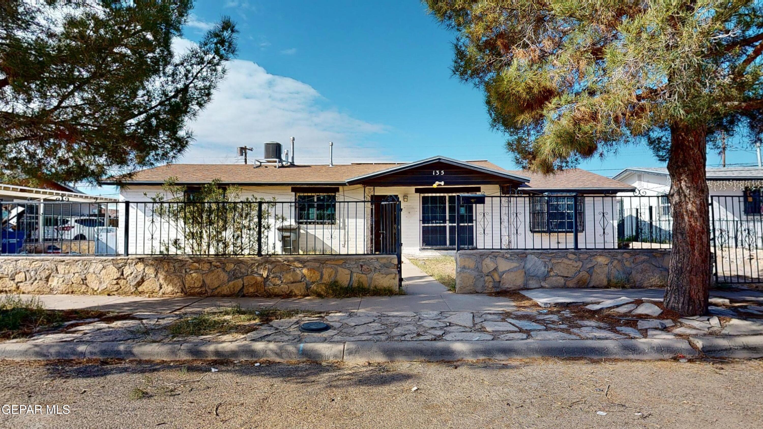 135 Baywood Road El Paso, TX 79915 - Photo 41 of 43 a front view of a house with a garden