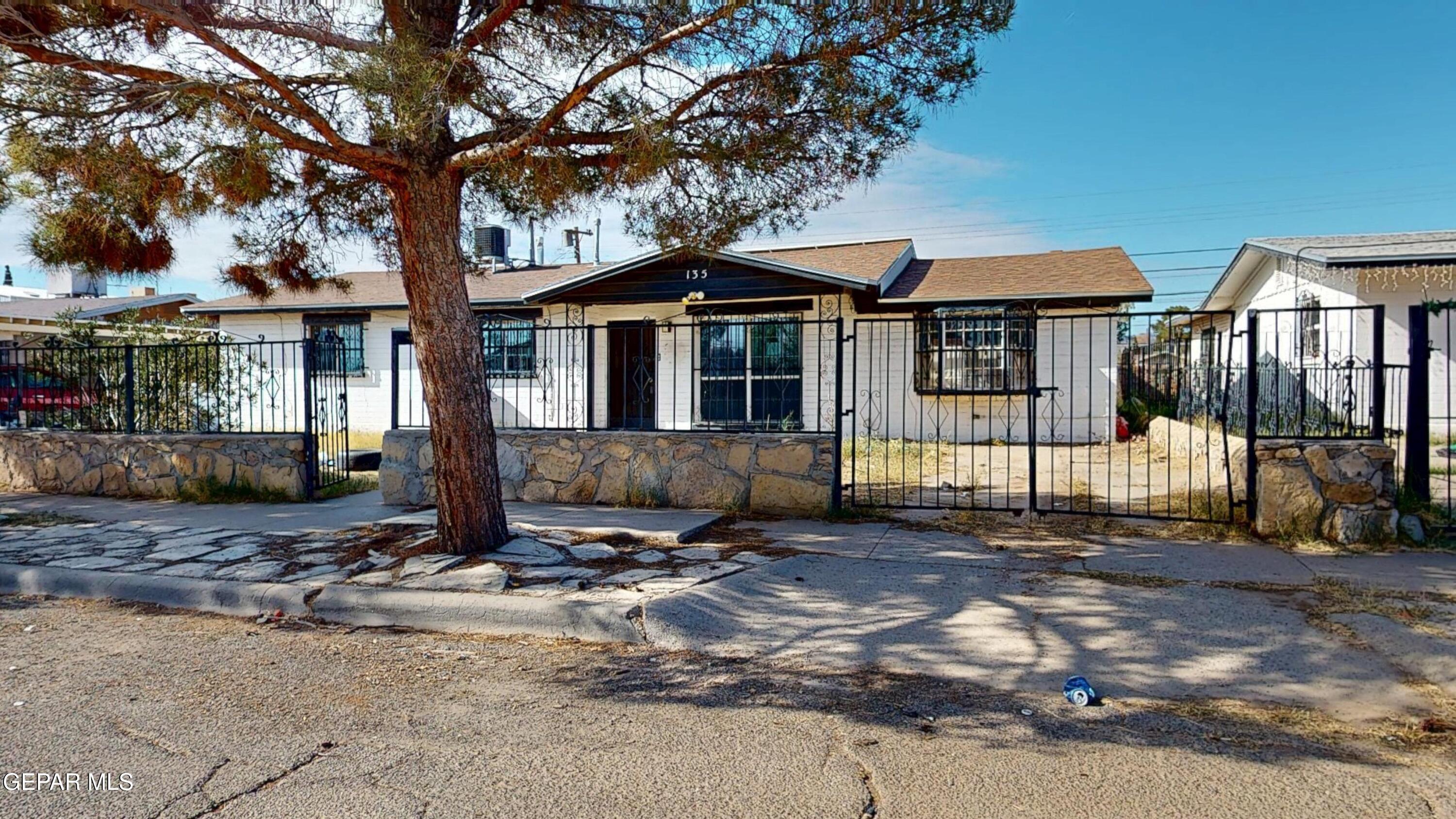 135 Baywood Road El Paso, TX 79915 - Photo 42 of 43 a front view of a house with a tree