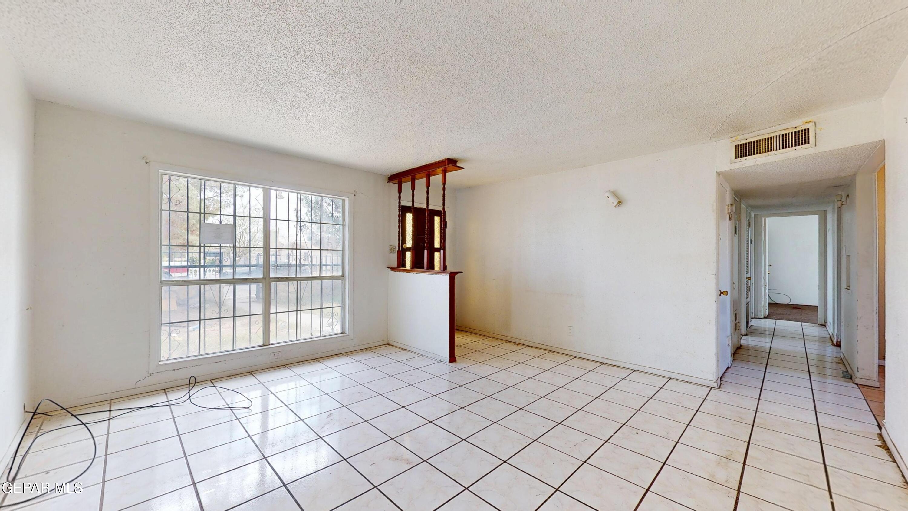 135 Baywood Road El Paso, TX 79915 - Photo 5 of 43 a view of an empty room and window