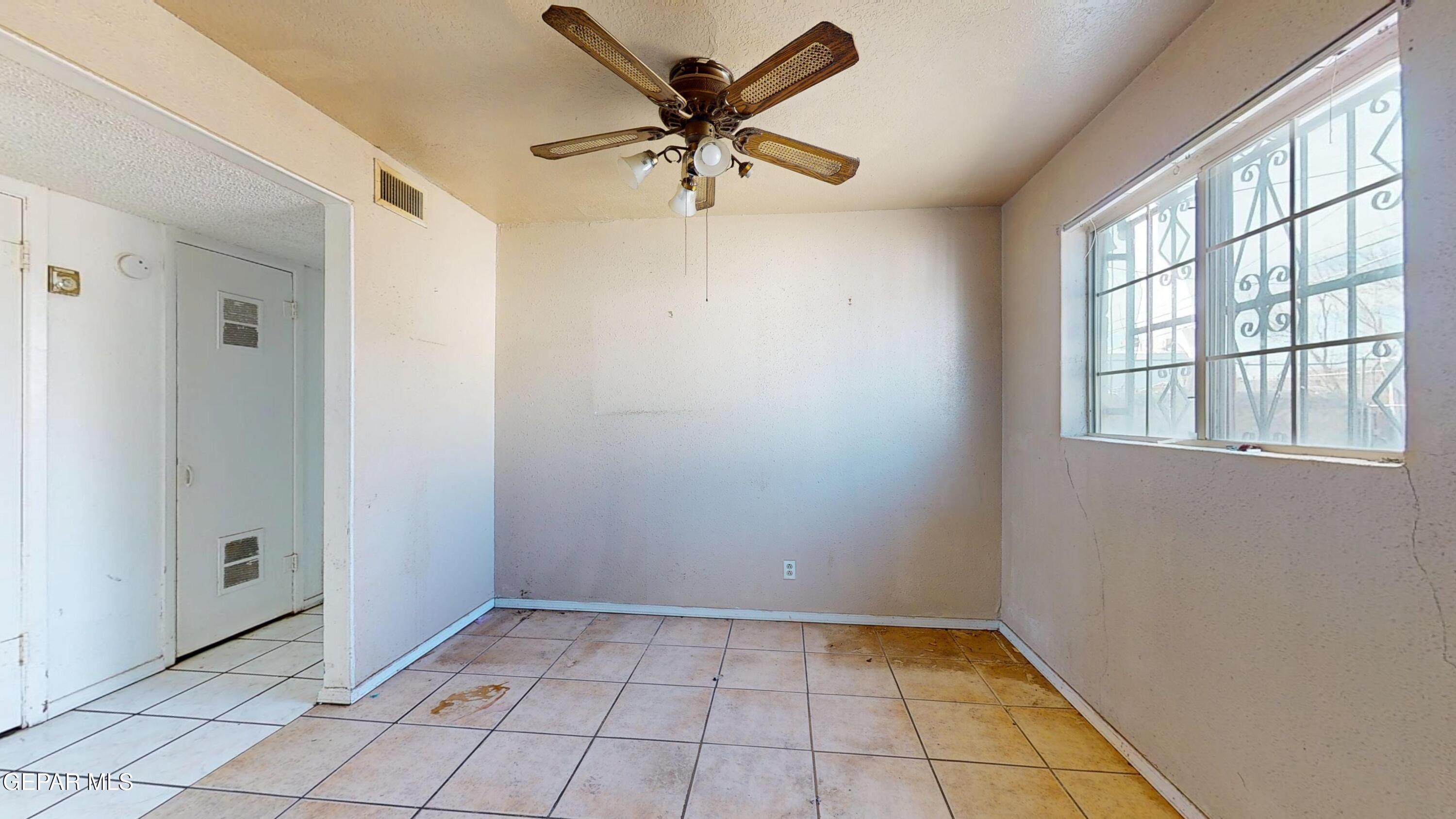 135 Baywood Road El Paso, TX 79915 - Photo 7 of 43 a view of an empty room with a window