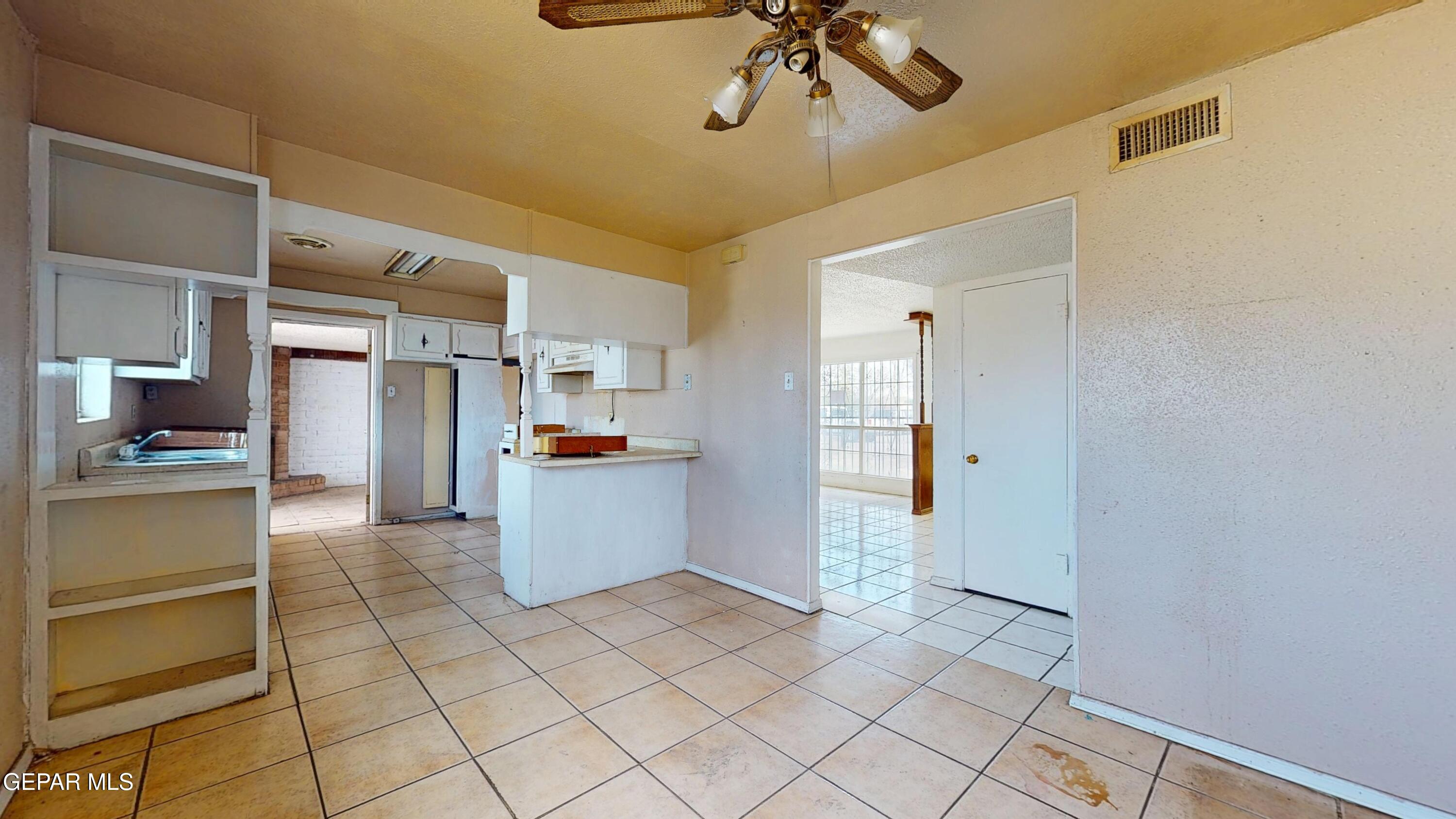 135 Baywood Road El Paso, TX 79915 - Photo 8 of 43 a kitchen with a refrigerator and microwave