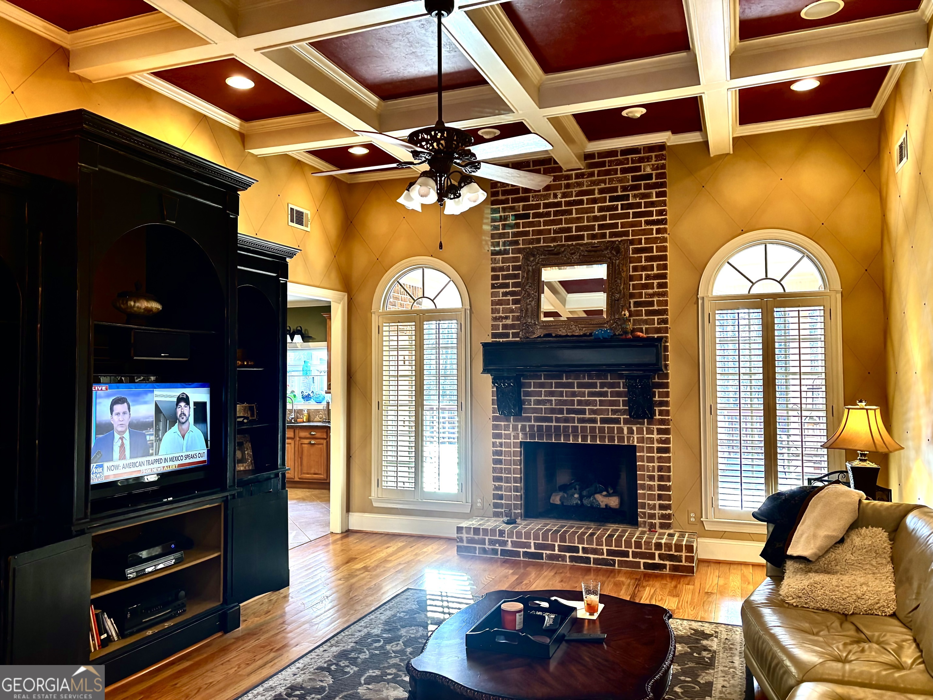 74 Waterford Path Hiram, GA 30141 - Photo 12 of 43 a living room with furniture a flat screen tv and a fireplace