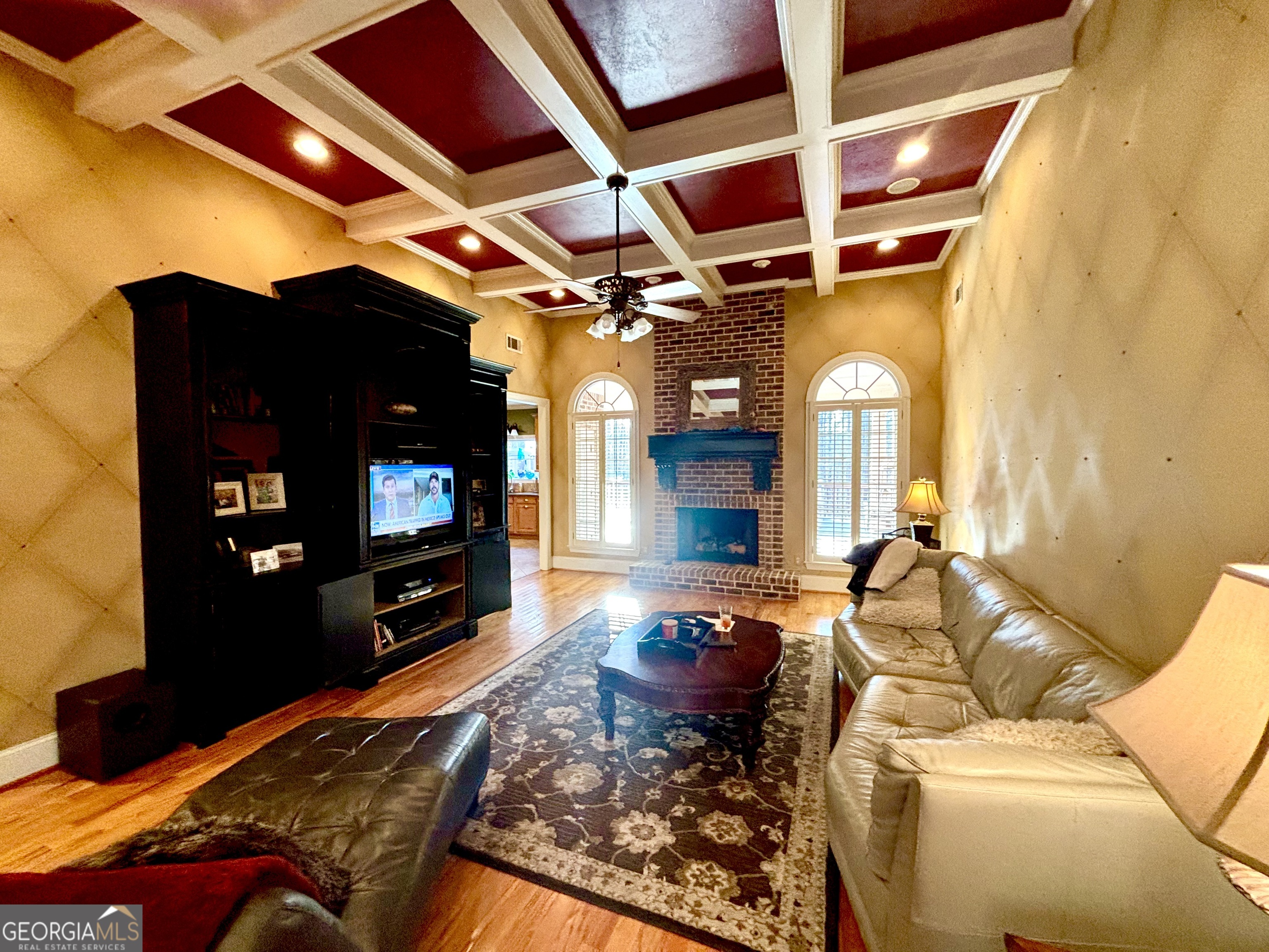 74 Waterford Path Hiram, GA 30141 - Photo 13 of 43 a living room with furniture a flat screen tv and a fireplace
