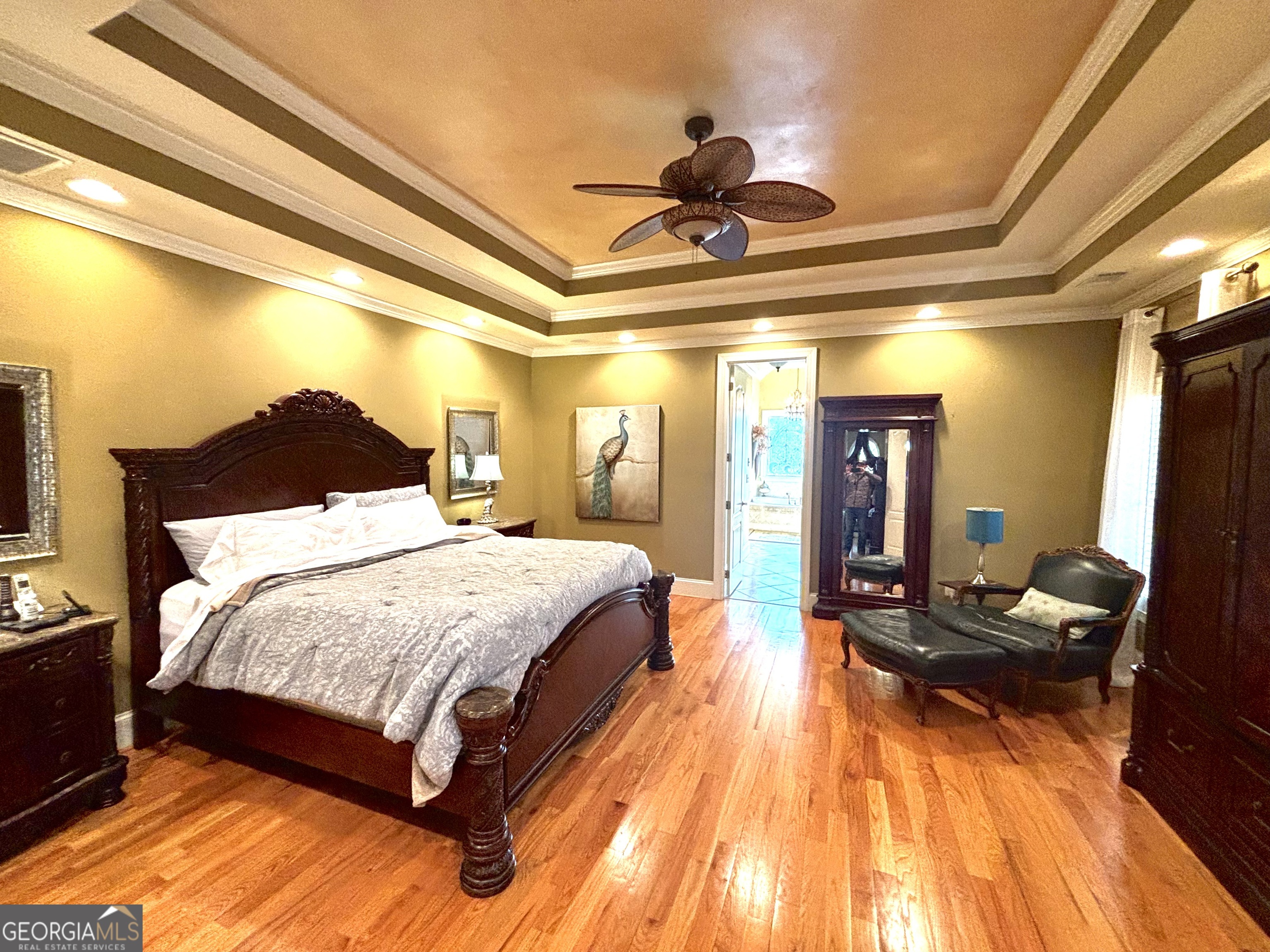 74 Waterford Path Hiram, GA 30141 - Photo 19 of 43 a spacious bedroom with a bed and wooden floor