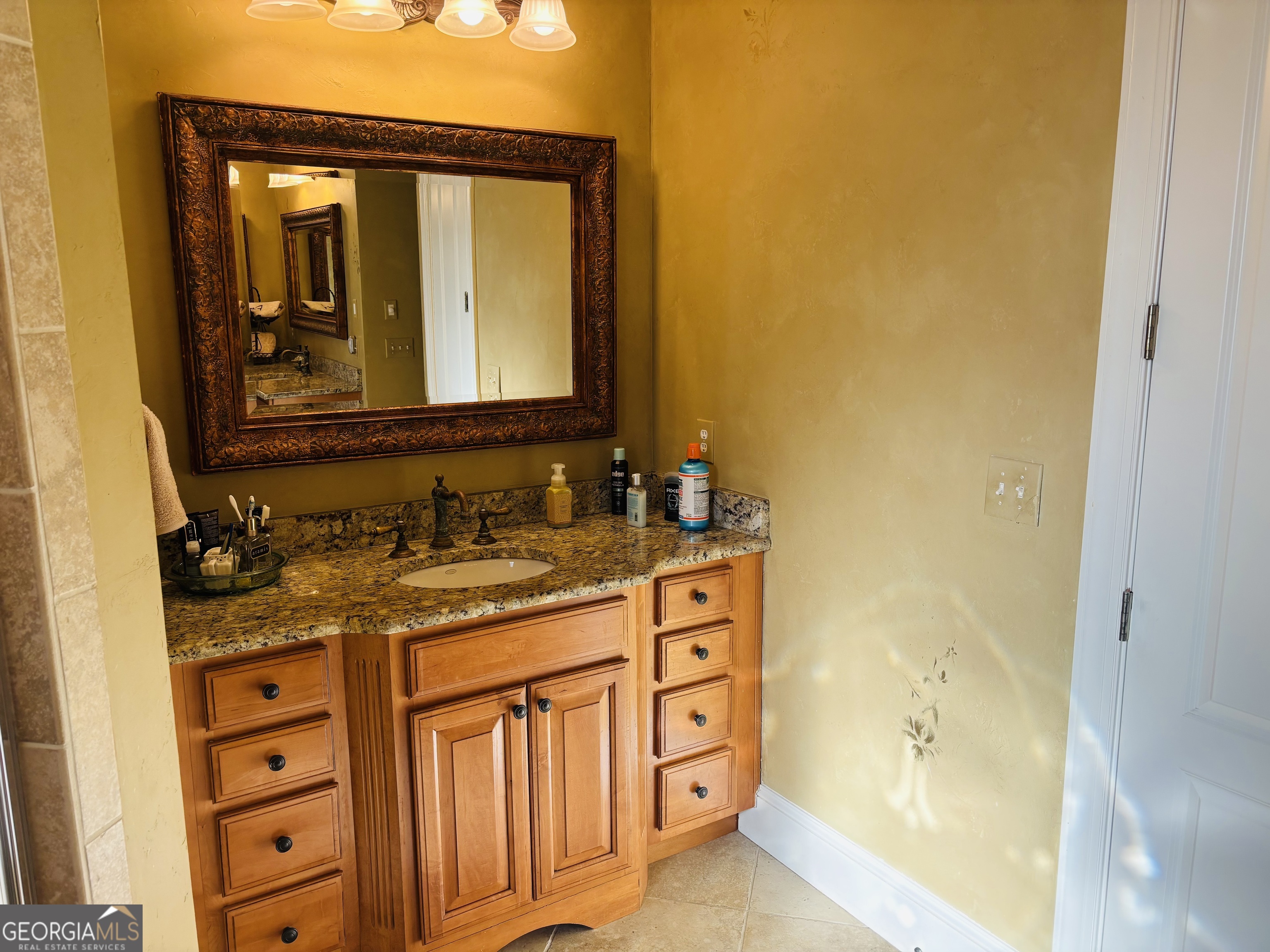 74 Waterford Path Hiram, GA 30141 - Photo 22 of 43 a bathroom with a granite countertop sink and a mirror