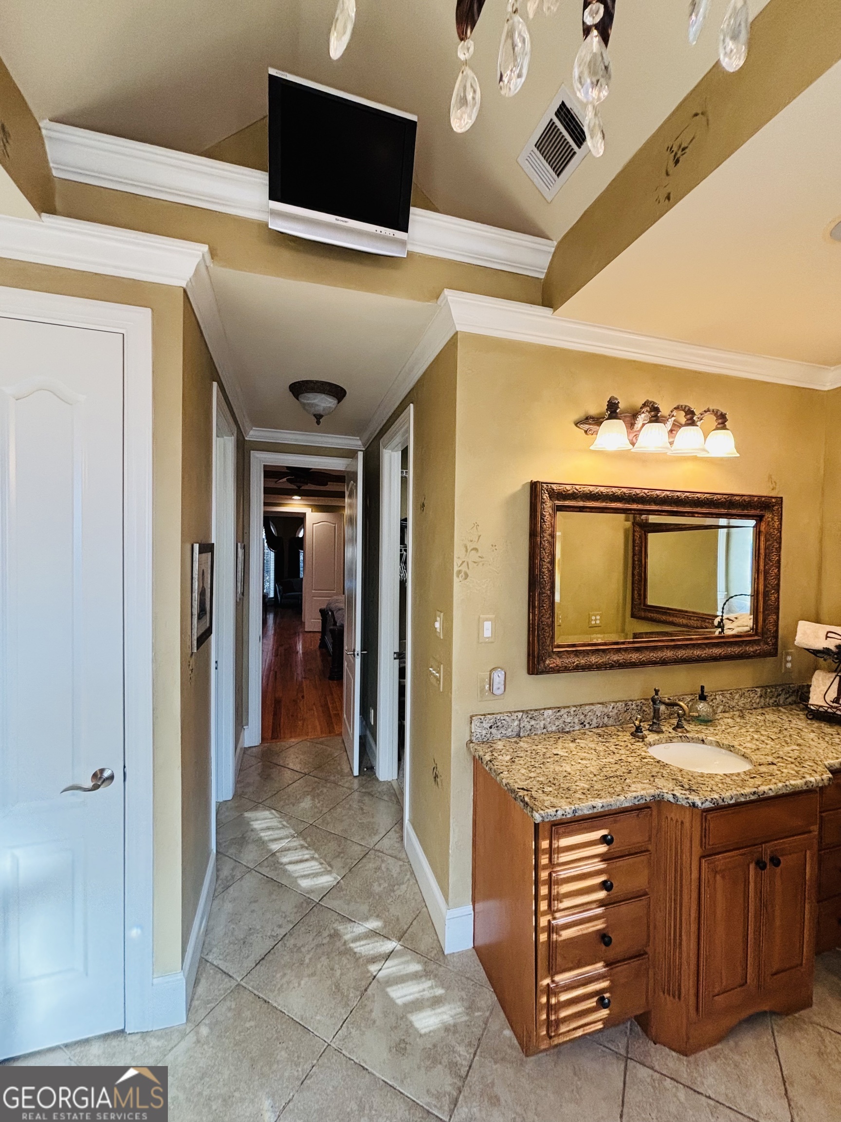 74 Waterford Path Hiram, GA 30141 - Photo 23 of 43 a bathroom with a sink a mirror and a shower