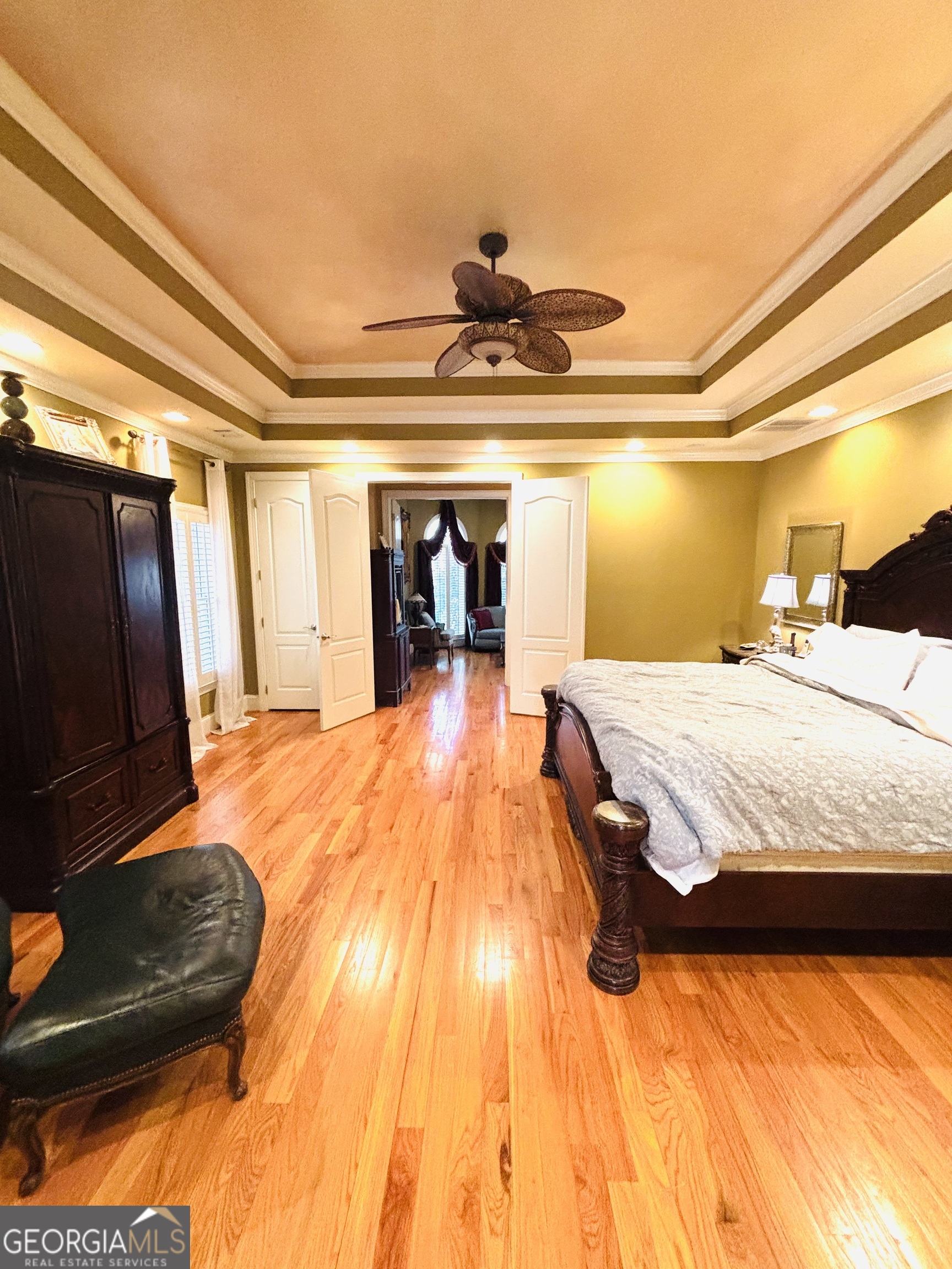 74 Waterford Path Hiram, GA 30141 - Photo 25 of 43 a bedroom with a bed and wooden floor