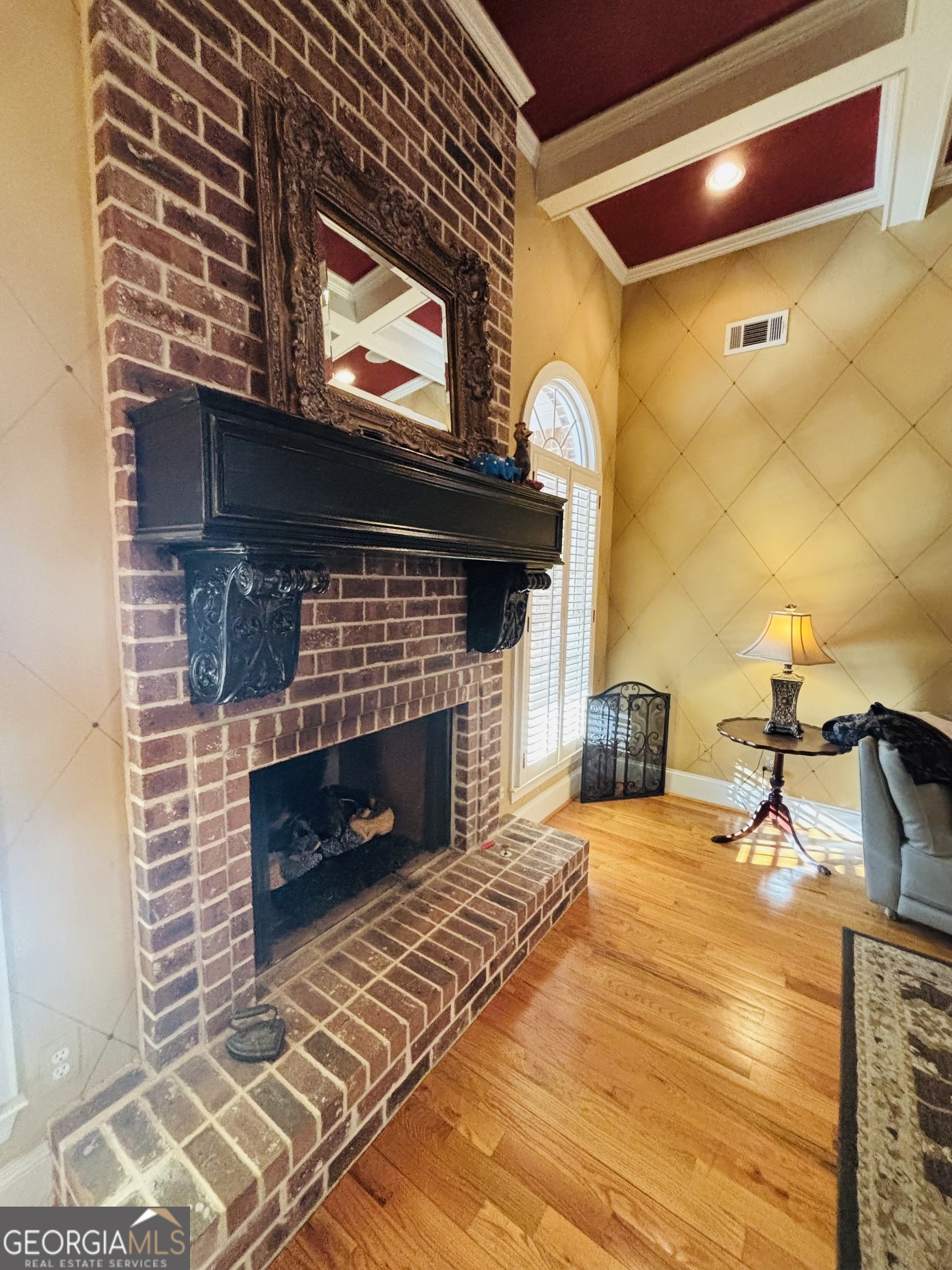 74 Waterford Path Hiram, GA 30141 - Photo 30 of 43 a living room with fireplace and a wooden floor