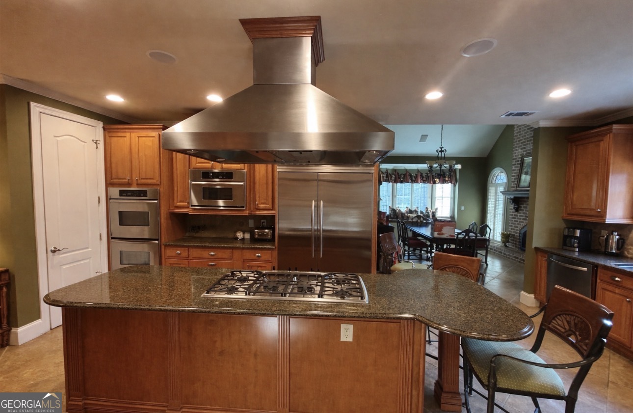 74 Waterford Path Hiram, GA 30141 - Photo 32 of 43 a kitchen with stainless steel appliances granite countertop a stove a refrigerator and a sink