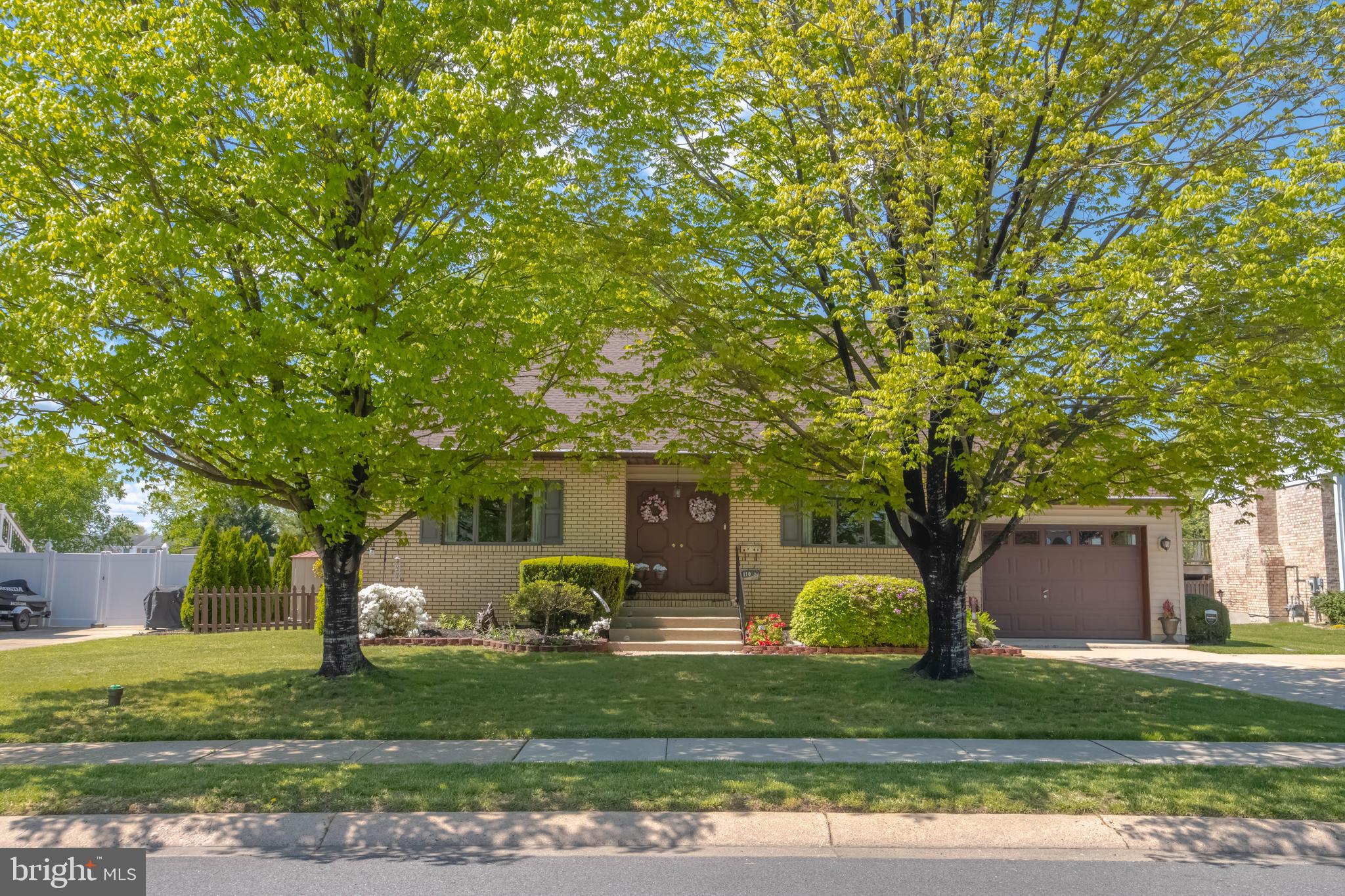 110 Shell Cove Court Joppa, MD 21085 - Photo 1 of 104 a front view of a house with garden and trees