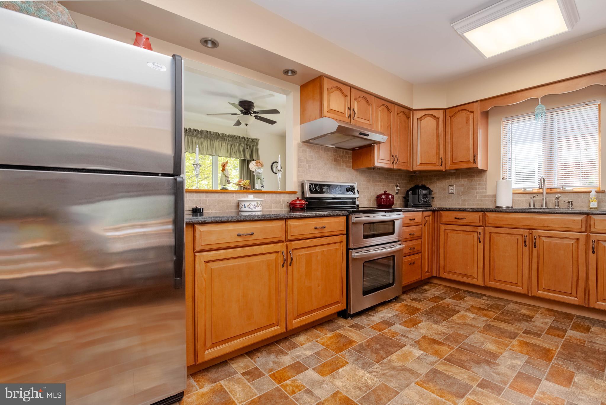 110 Shell Cove Court Joppa, MD 21085 - Photo 15 of 104 a kitchen with a stove top oven sink and cabinets
