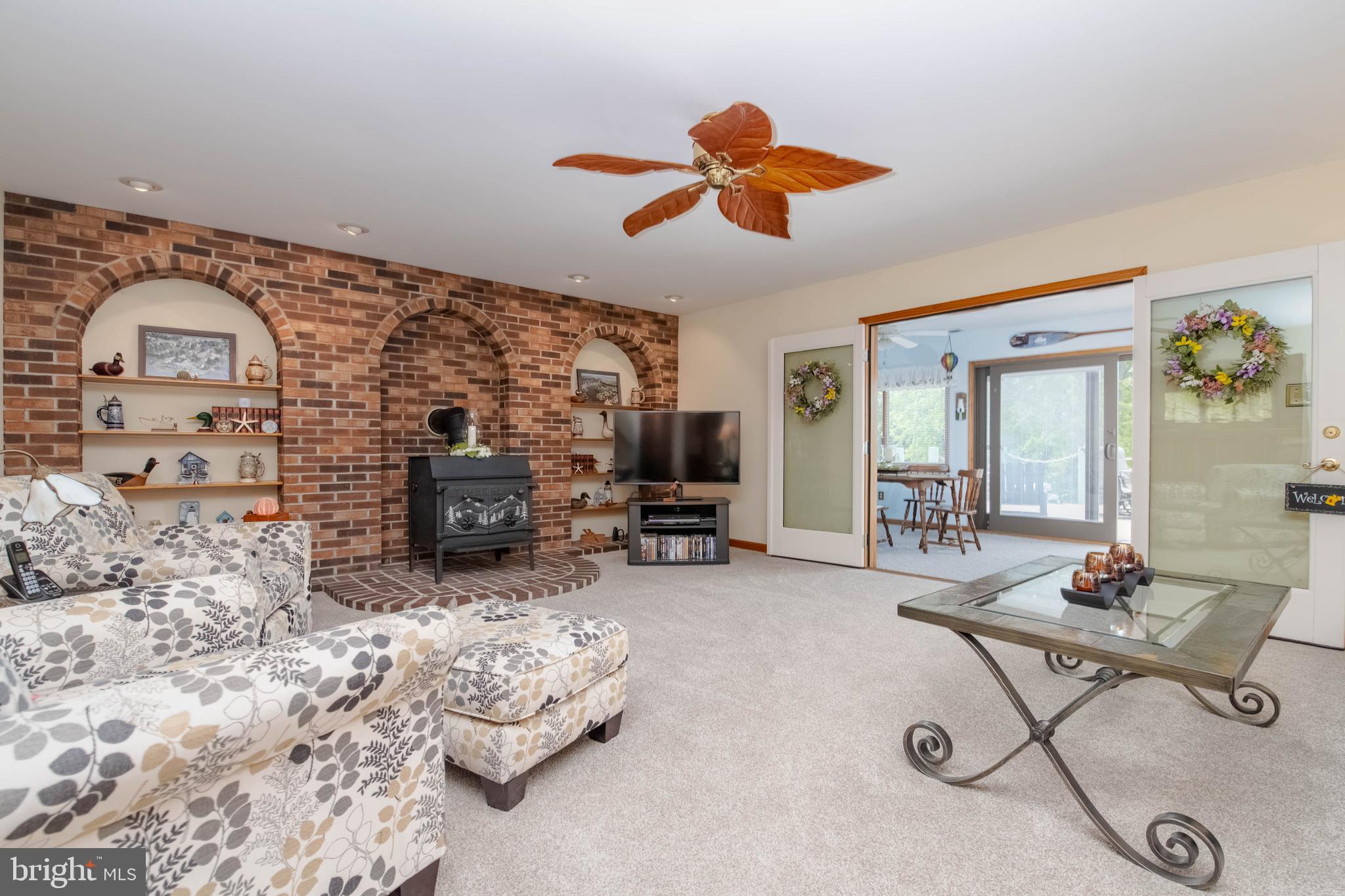 110 Shell Cove Court Joppa, MD 21085 - Photo 21 of 104 a living room with furniture a fireplace and a flat screen tv