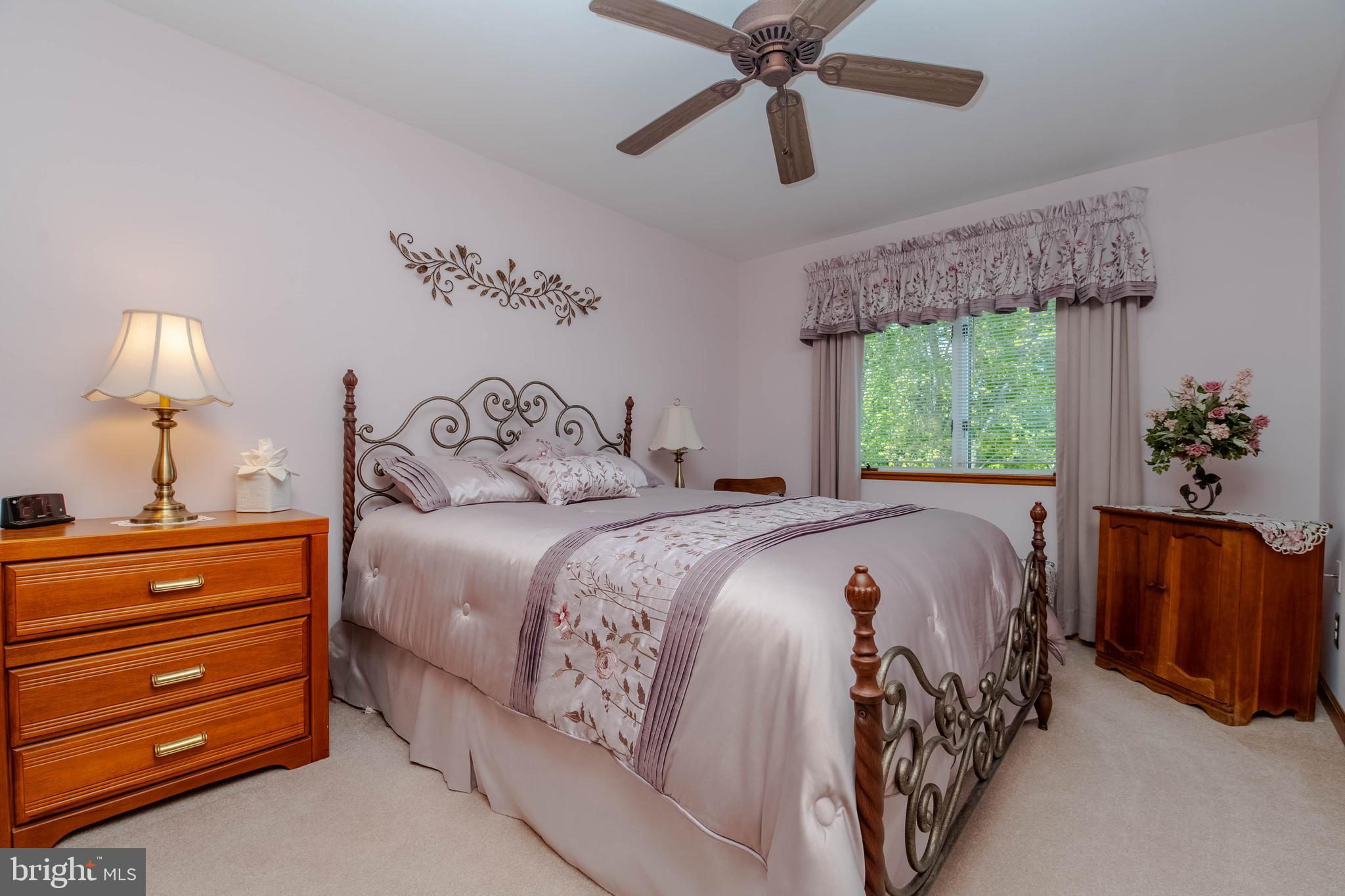 110 Shell Cove Court Joppa, MD 21085 - Photo 65 of 104 a bedroom with a bed and a chandelier