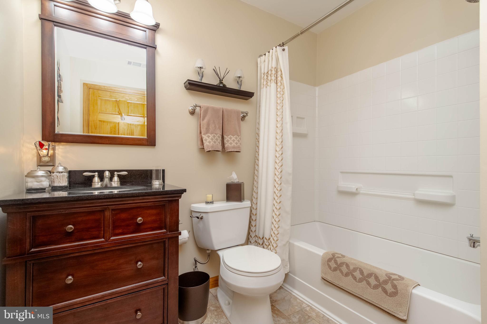 110 Shell Cove Court Joppa, MD 21085 - Photo 67 of 104 a bathroom with a toilet a sink and mirror