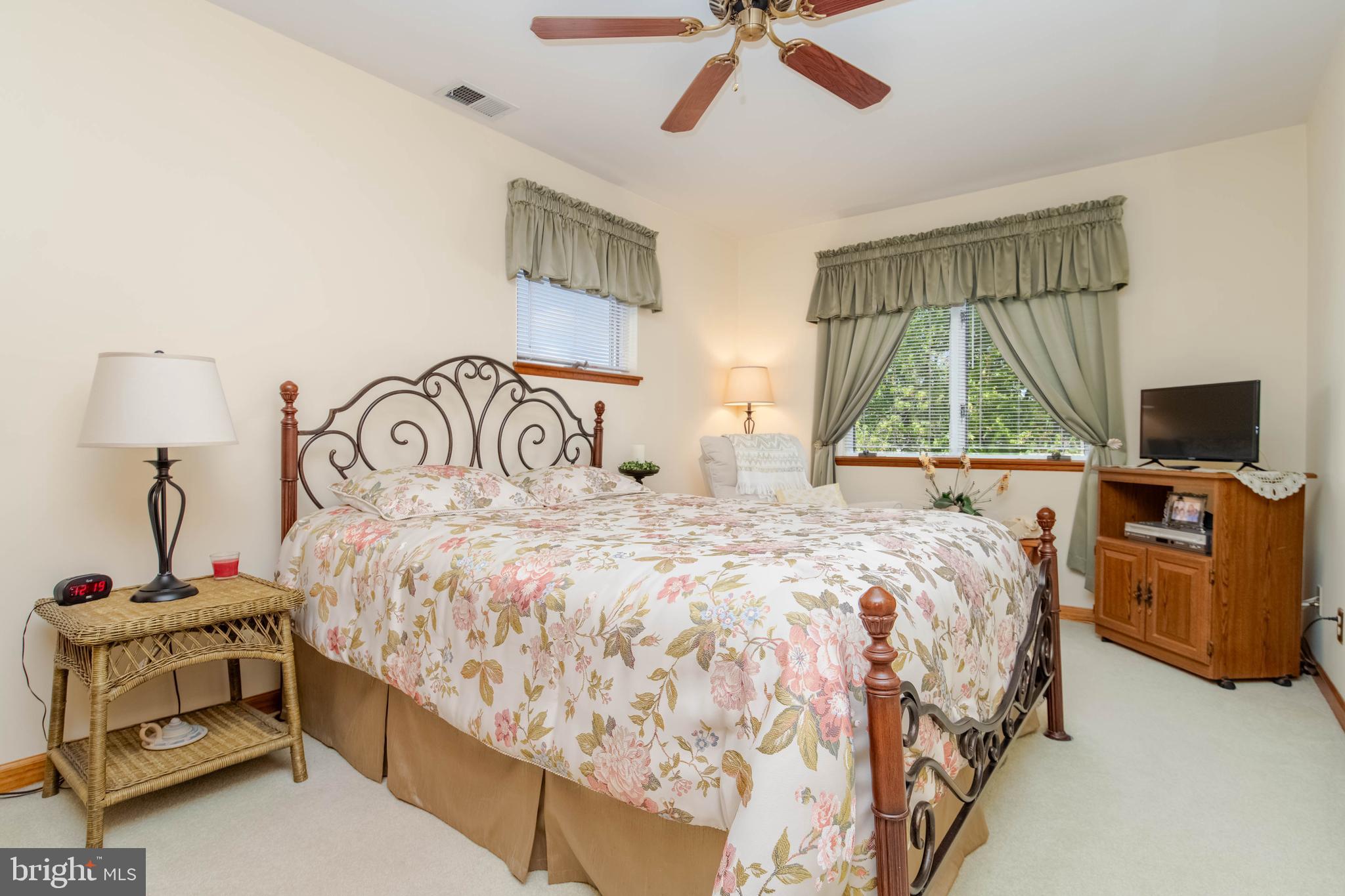 110 Shell Cove Court Joppa, MD 21085 - Photo 73 of 104 a bedroom with a bed and a television
