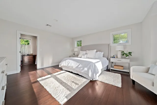 a bedroom with a bed and a couch