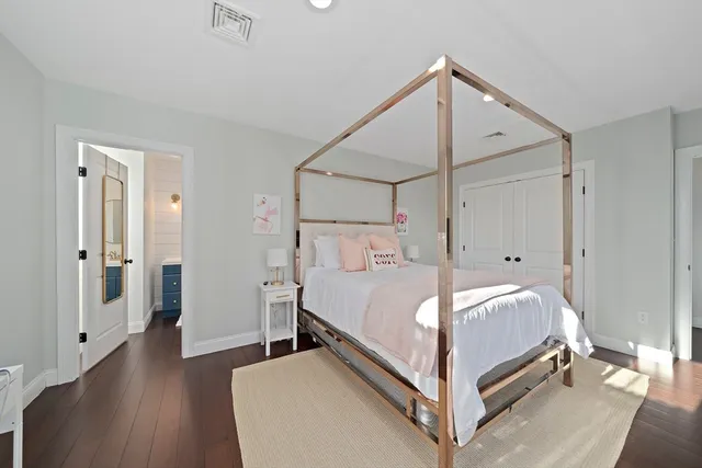 a bed room with a bed and a table