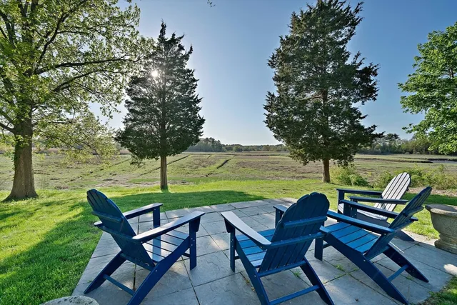 a view of a chairs and table in the yard
