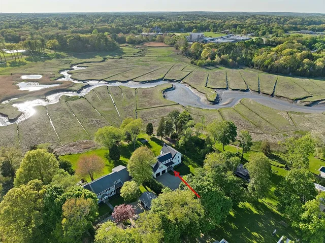 an aerial view of a house with a lake view
