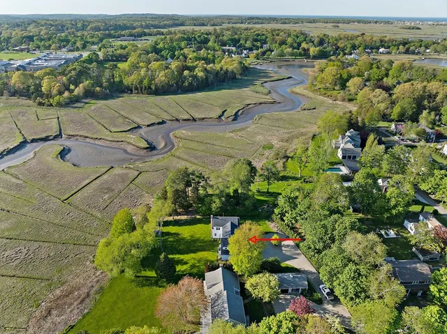 an aerial view of residential houses with outdoor space