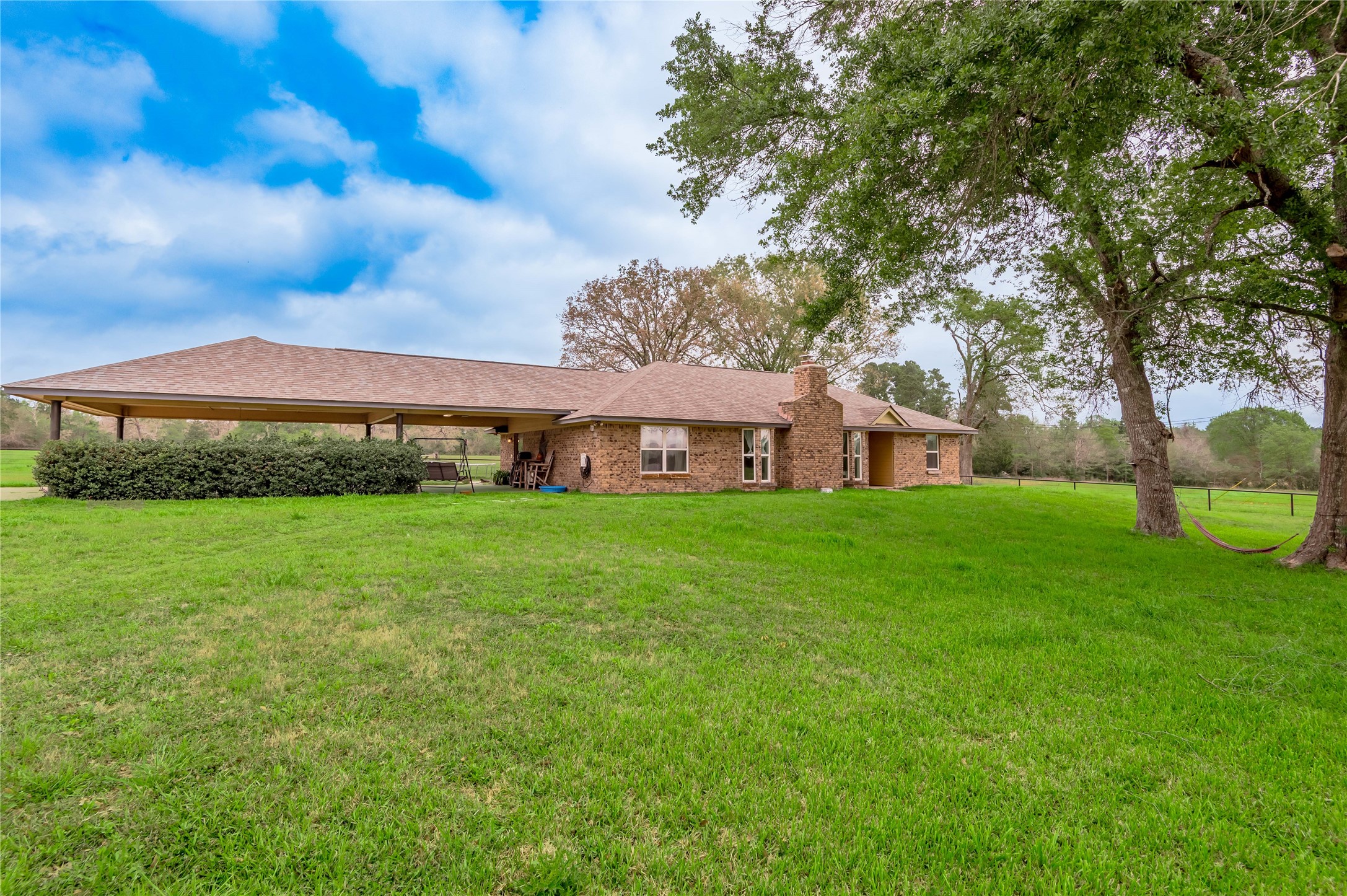 758 Wire Road Huntsville, TX 77320 - Photo 1 of 44 a view of a house with a big yard