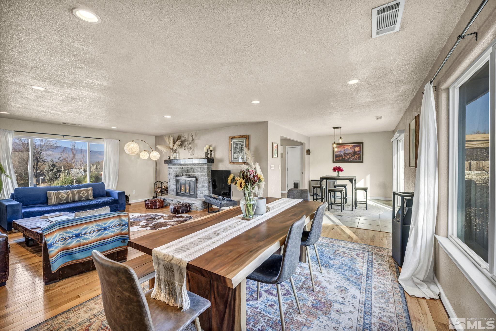14660 Chamy Drive Reno, NV 89521 - Photo 13 of 38 a dining room with furniture a rug and wooden floor