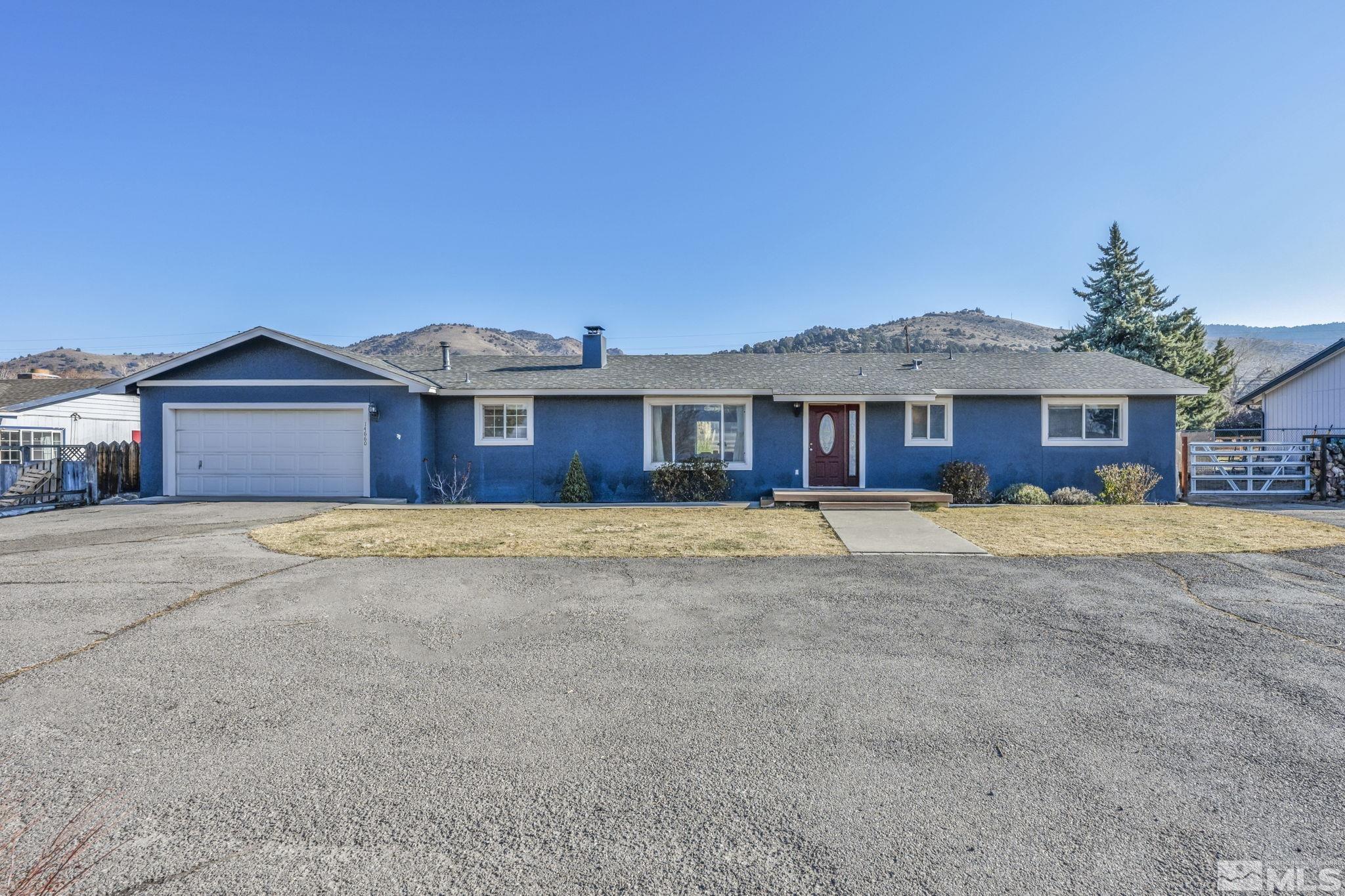 14660 Chamy Drive Reno, NV 89521 - Photo 2 of 38 a front view of a house with a yard