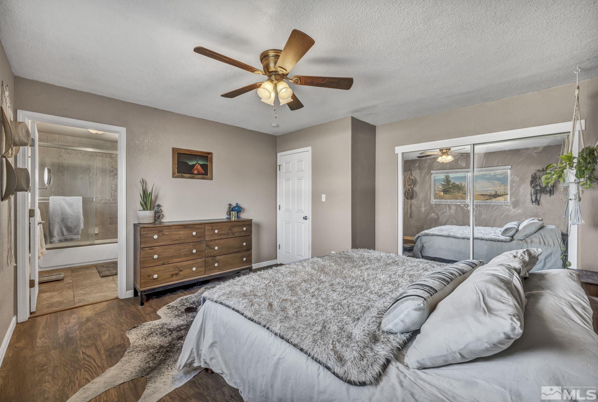 14660 Chamy Drive Reno, NV 89521 - Photo 23 of 38 a bedroom with a bed and a dresser