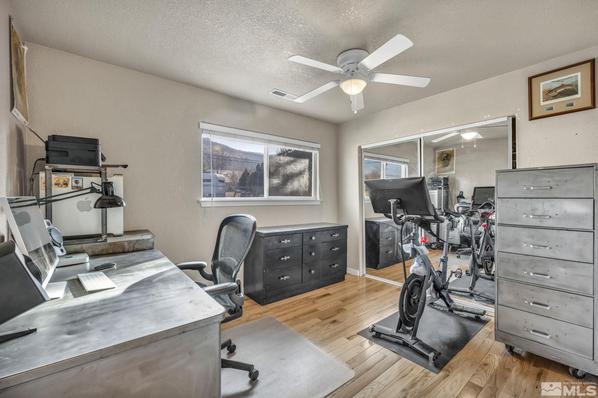 14660 Chamy Drive Reno, NV 89521 - Photo 26 of 38 a view of a workspace with furniture and gym equipment