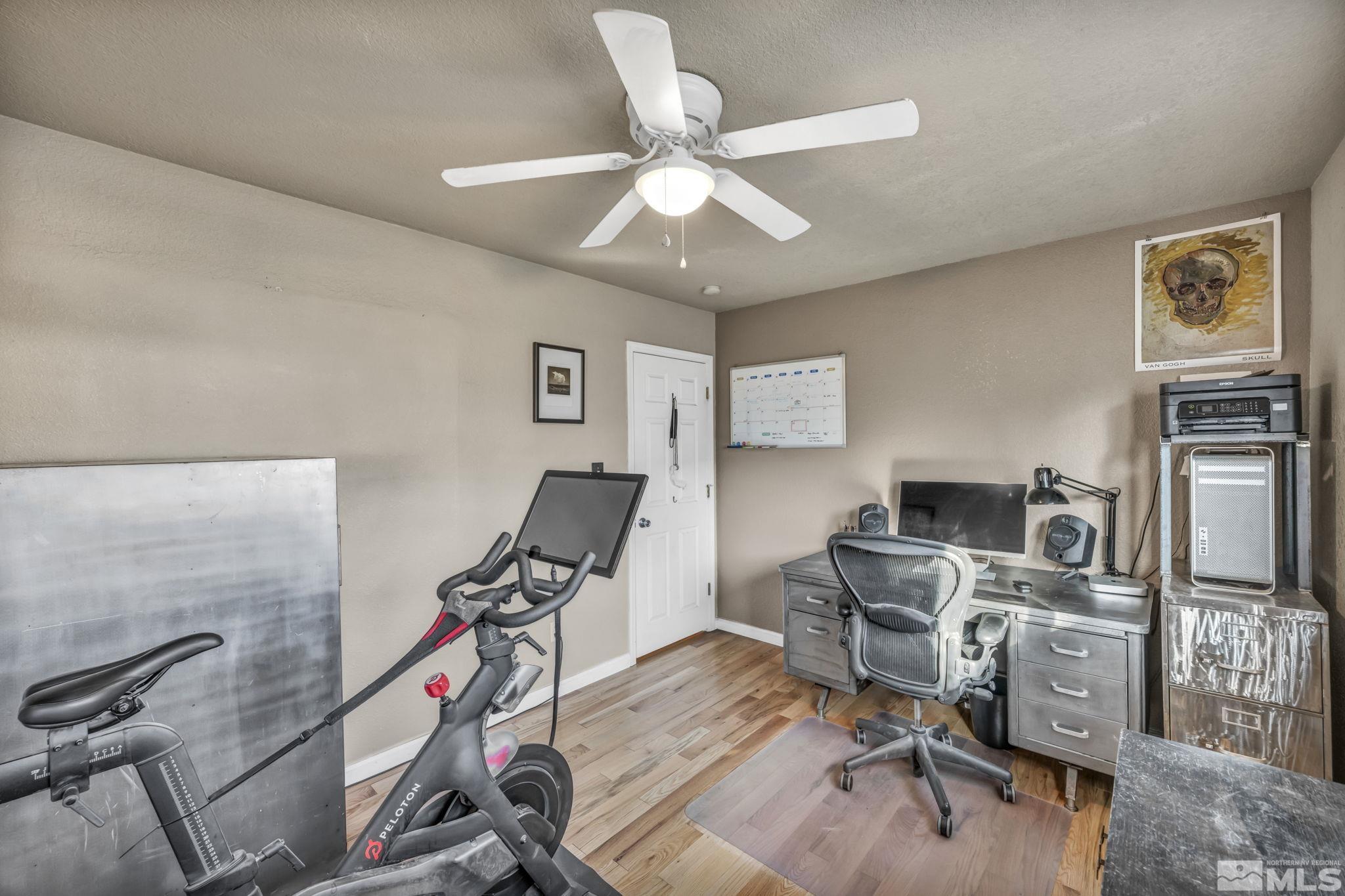 14660 Chamy Drive Reno, NV 89521 - Photo 27 of 38 a view of a workspace with furniture and a ceiling fan