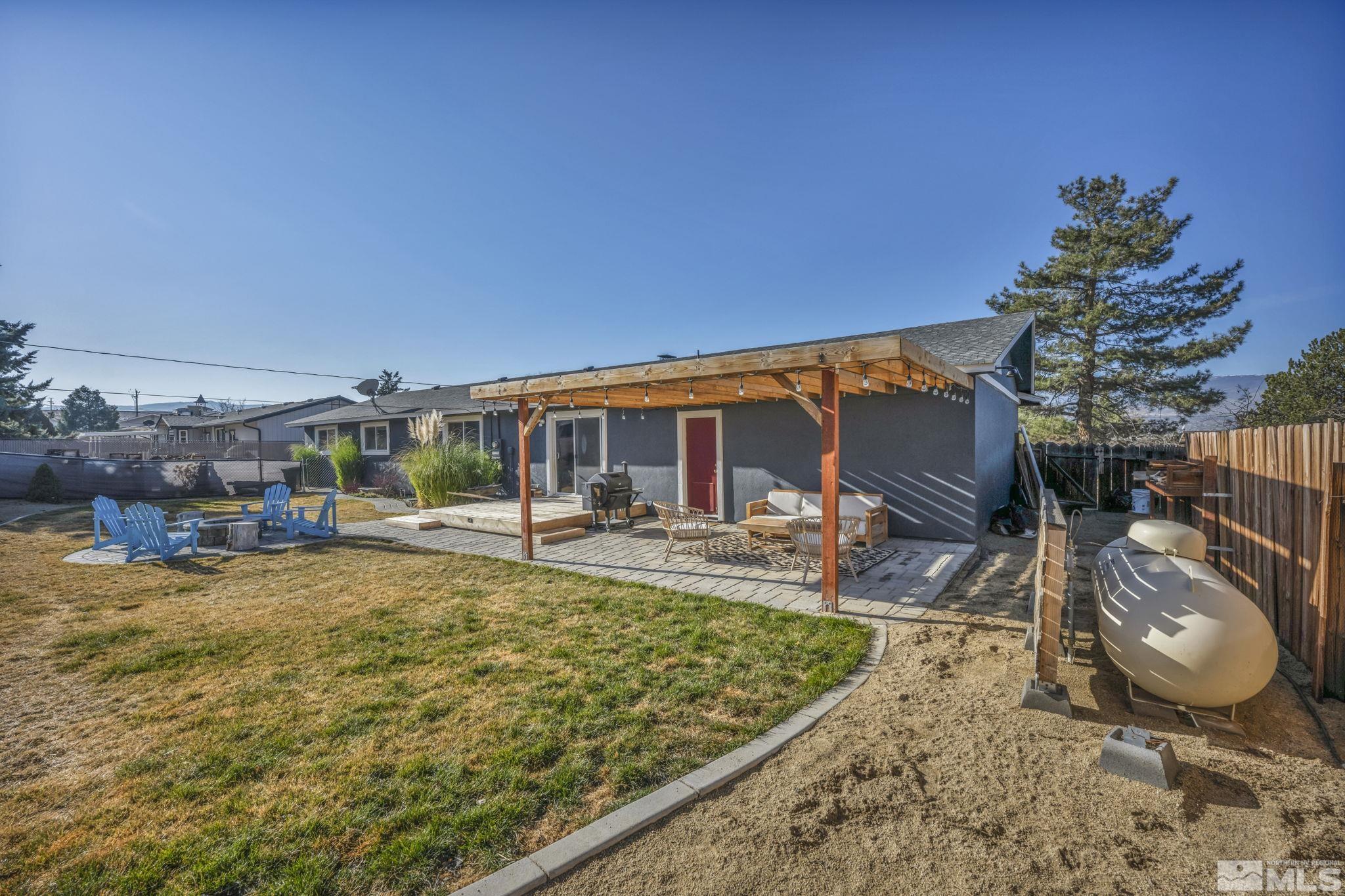 14660 Chamy Drive Reno, NV 89521 - Photo 30 of 38 a view of a swimming pool with a patio