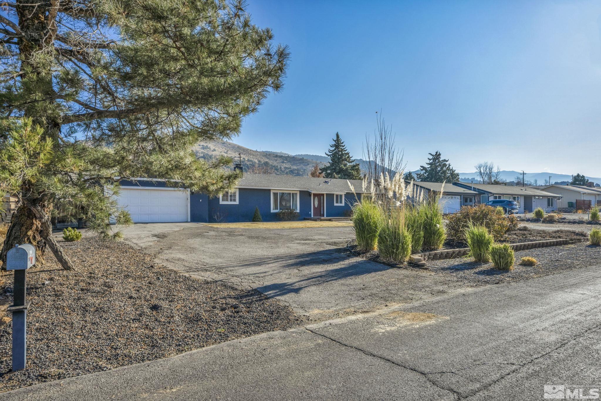14660 Chamy Drive Reno, NV 89521 - Photo 3 of 38 a front view of a house with a yard