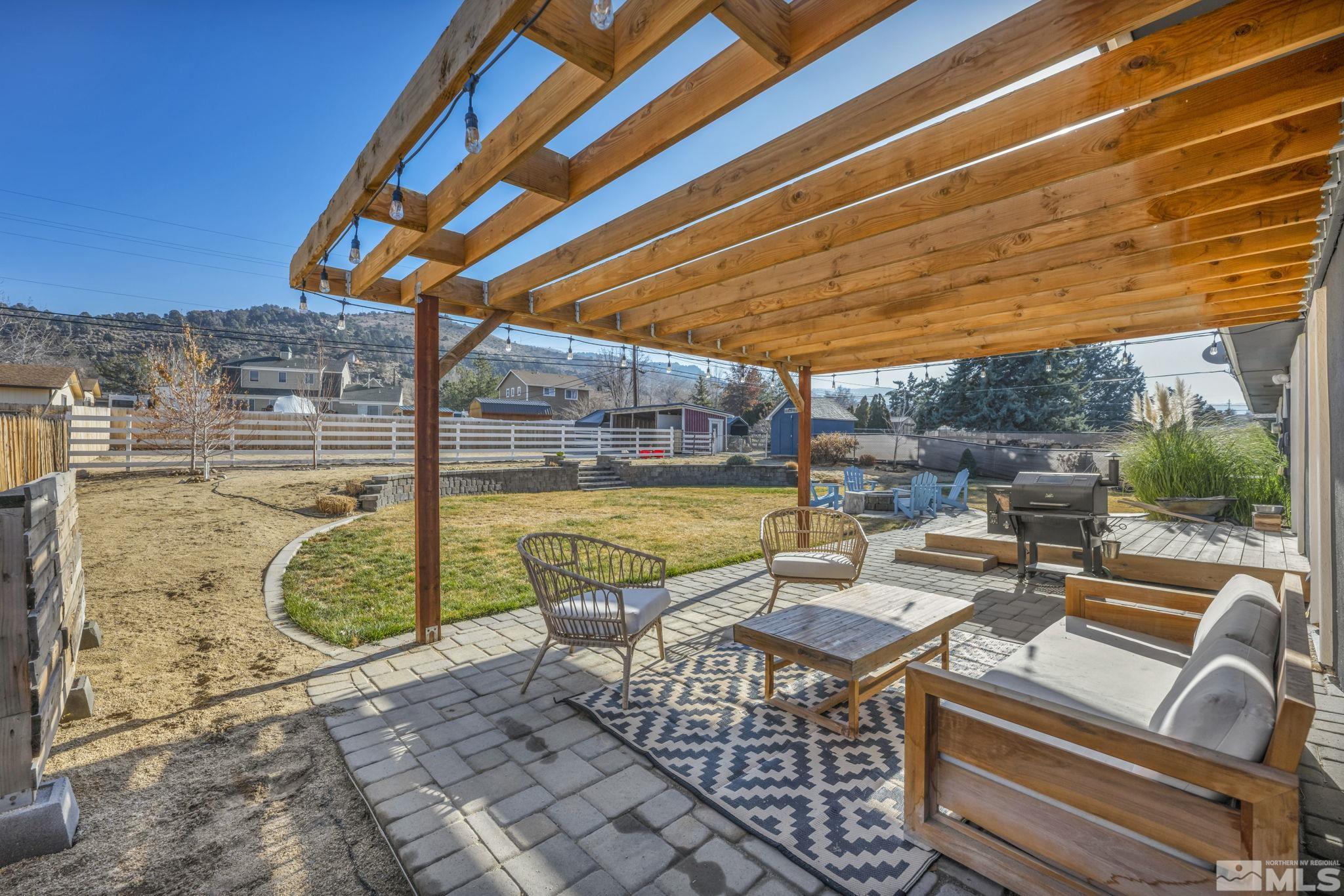14660 Chamy Drive Reno, NV 89521 - Photo 33 of 38 a view of a patio with a table and chairs