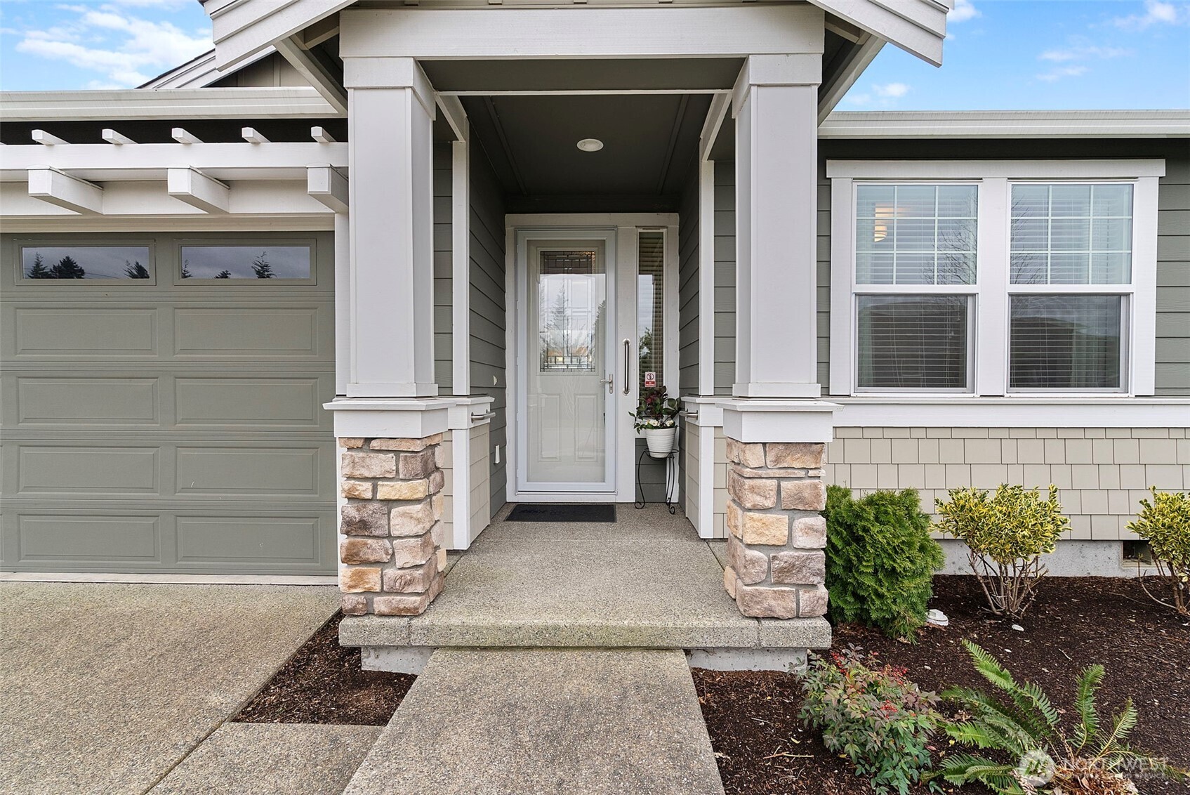 front view of a house with a yard