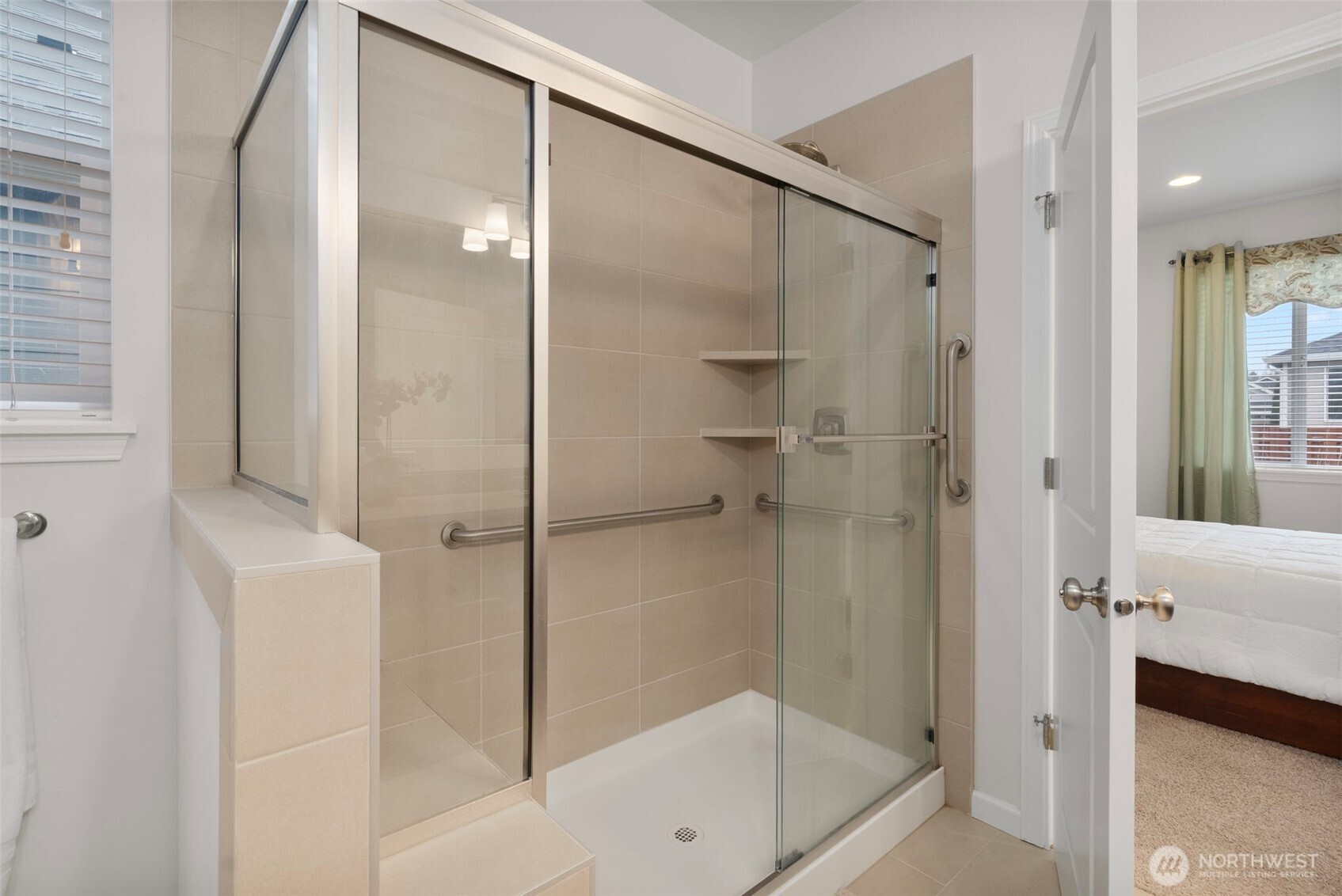 3311 Colville Street Southeast Lacey, WA 98513 - Photo 13 of 40 a bathroom with a shower and a bath tub