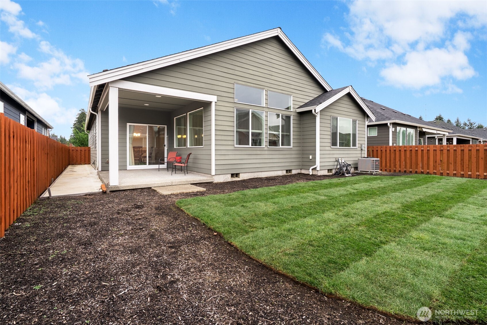 3311 Colville Street Southeast Lacey, WA 98513 - Photo 19 of 40 a front view of a house with garden