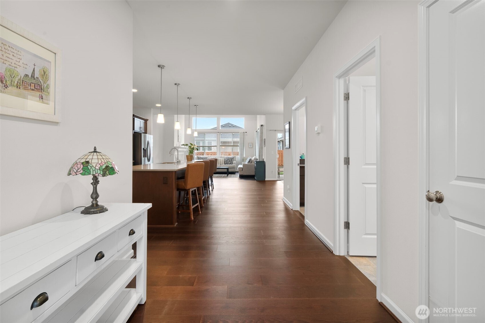 3311 Colville Street Southeast Lacey, WA 98513 - Photo 3 of 40 a dining hall with stainless steel appliances kitchen island granite countertop furniture and a chandelier