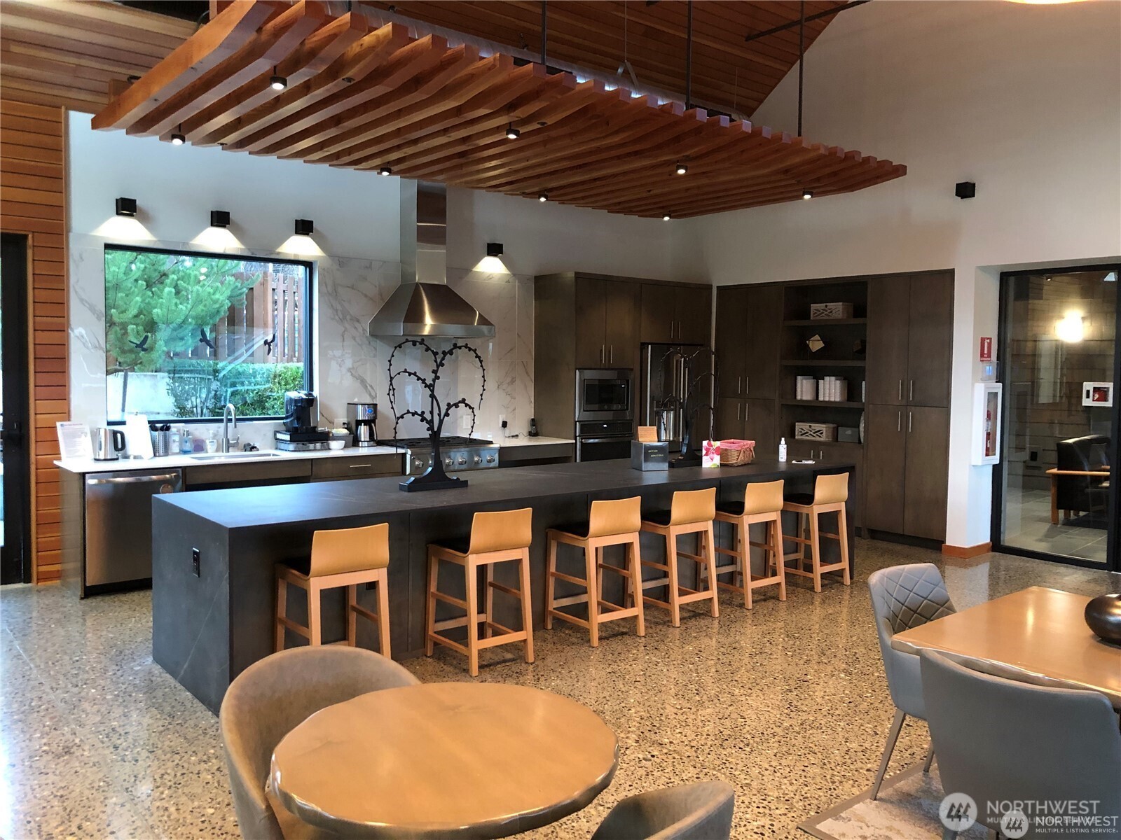 3311 Colville Street Southeast Lacey, WA 98513 - Photo 36 of 40 a large kitchen with lots of counter space dining table and a sink