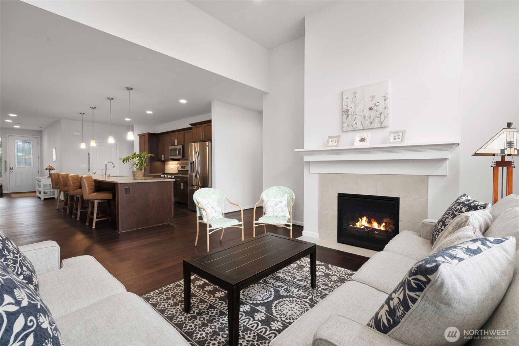 3311 Colville Street Southeast Lacey, WA 98513 - Photo 8 of 40 a living room with furniture a table and a fireplace